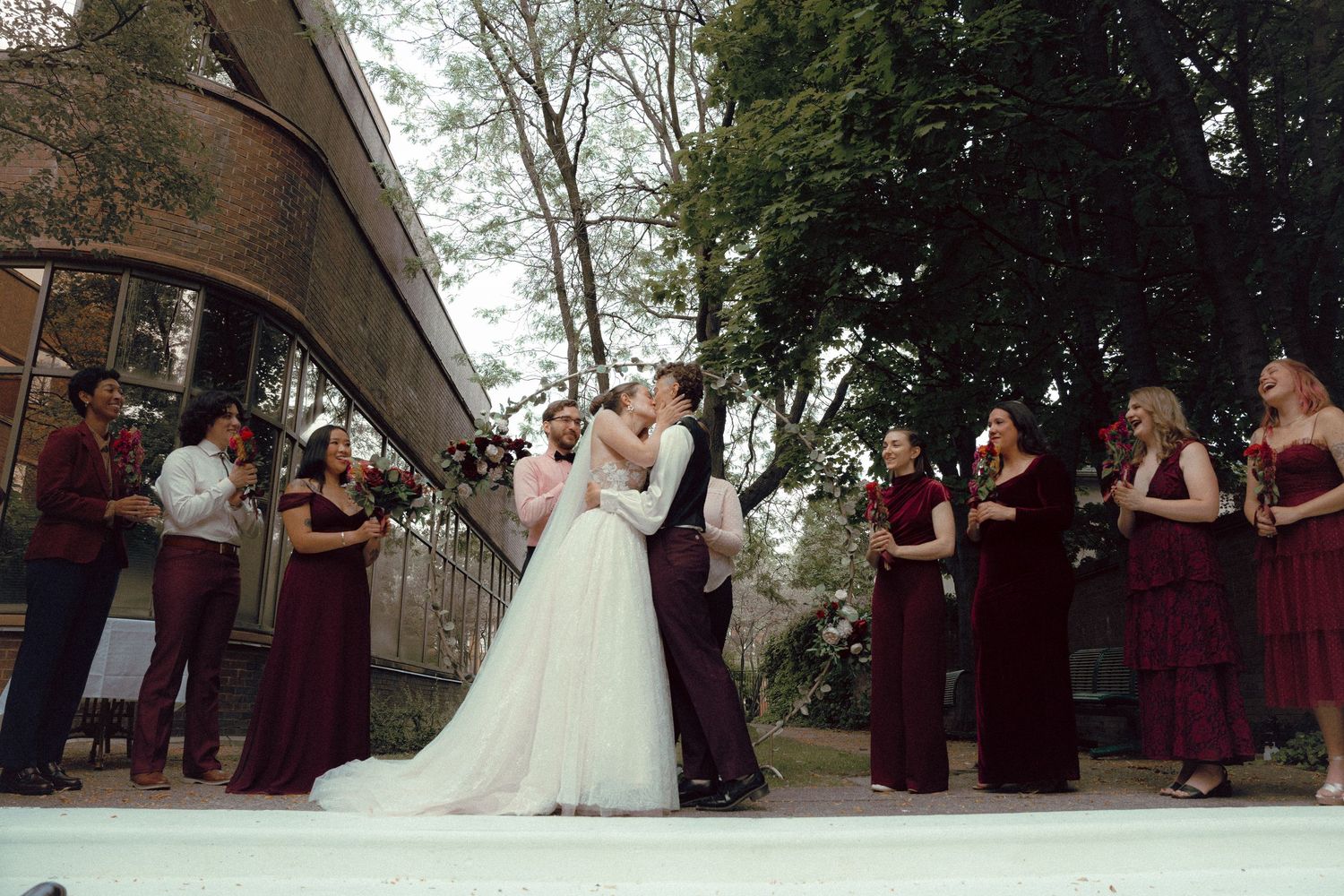 brides first kiss during their Intimate queer wedding ceremony at Granite Brewery Toronto