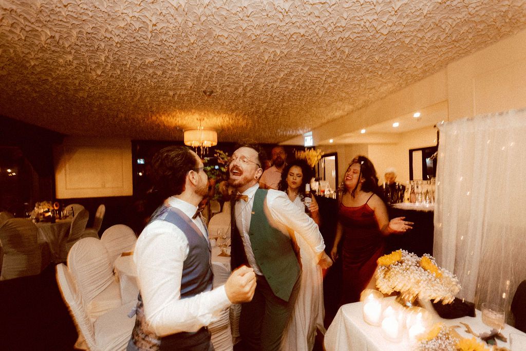 Multicultural wedding reception with guests dancing at gay wedding Fantasy Farm Toronto
