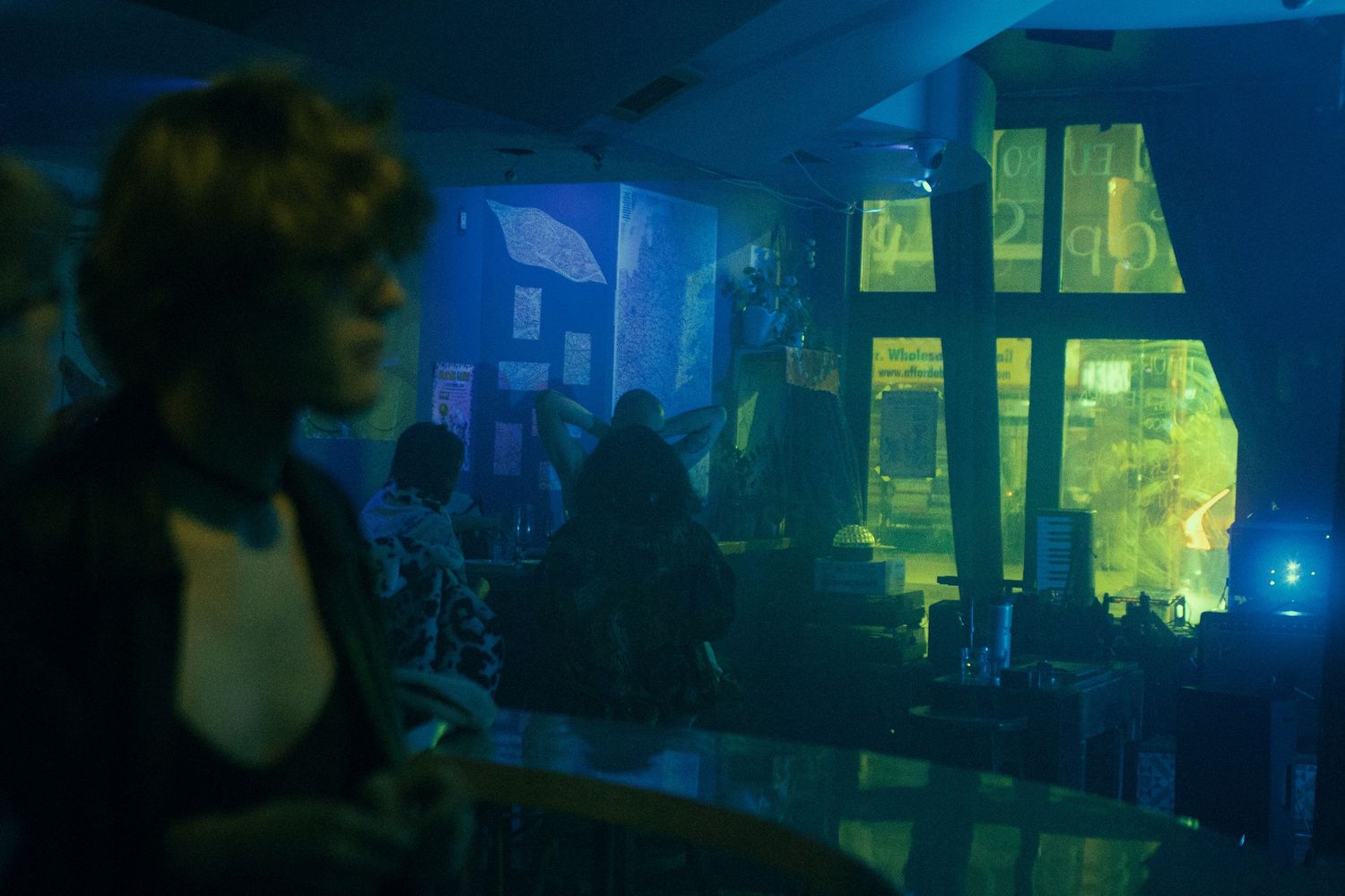 Queer couple kissing each other during Metamorphosis, a trans Pride party.