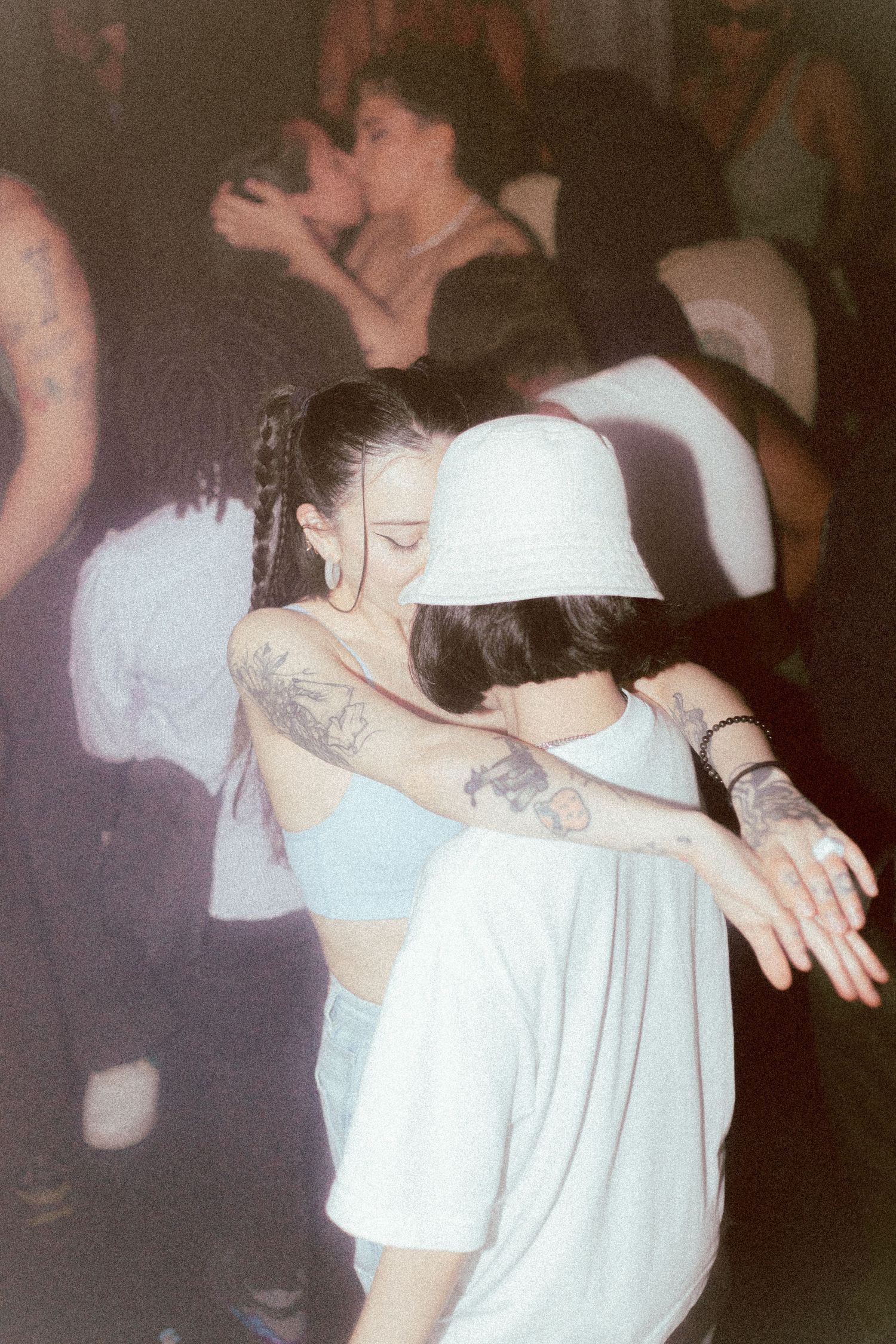 Photo of two lesbians dancing in the middle of the dance floor during YES YES Y'ALL birthday party