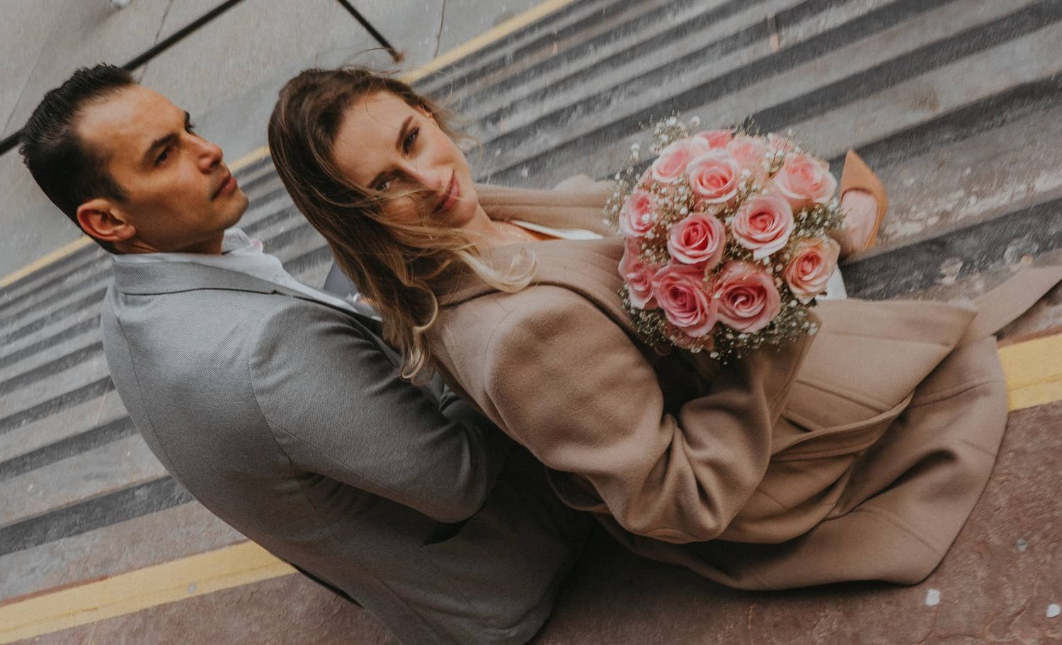 Overhead portrait of bride holding bouquet before Toronto City Hall wedding ceremony