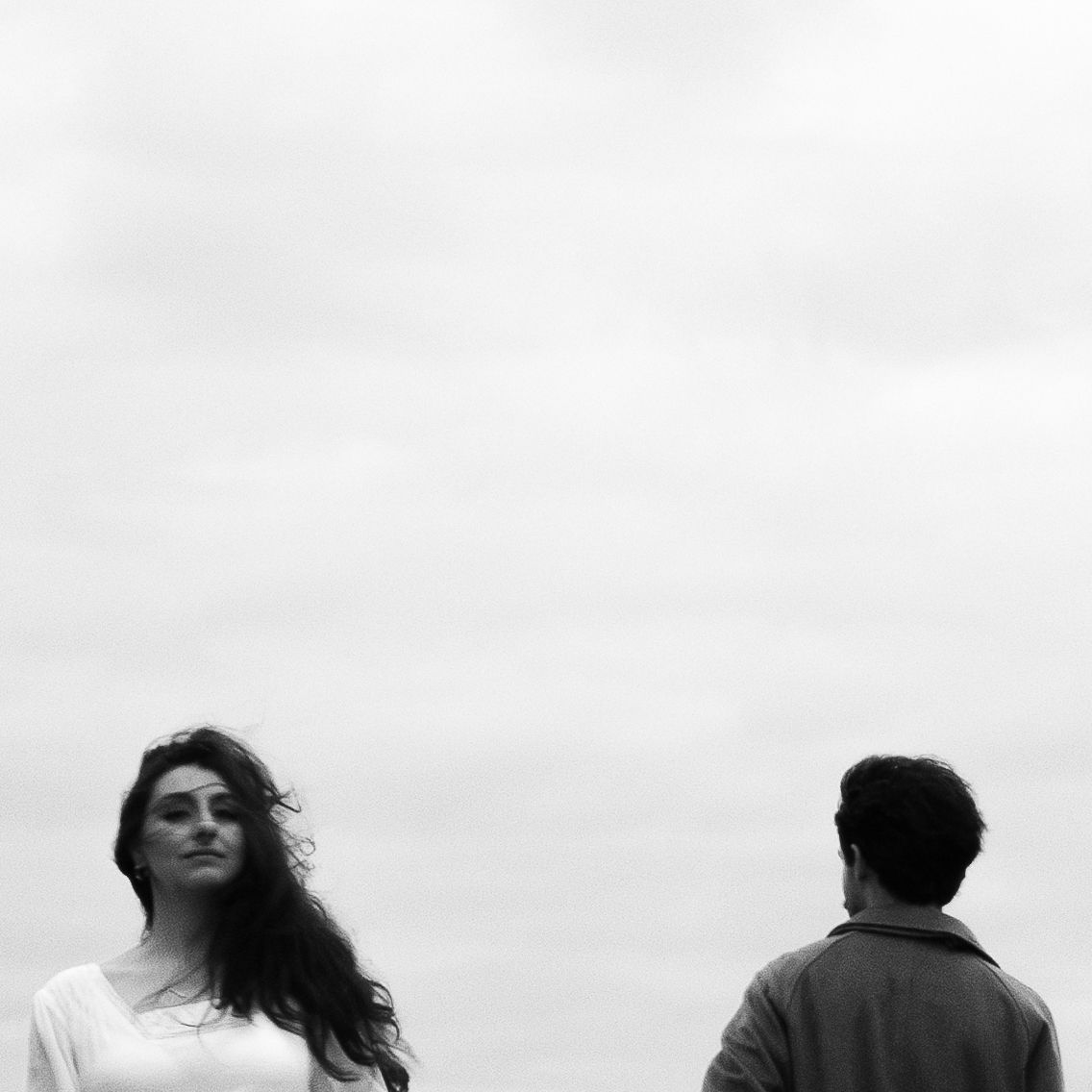 Olivia and Zane engagement session from their home to Queen West and Scarborough Bluffs, moody, unposed, intimate couple photos in Toronto.