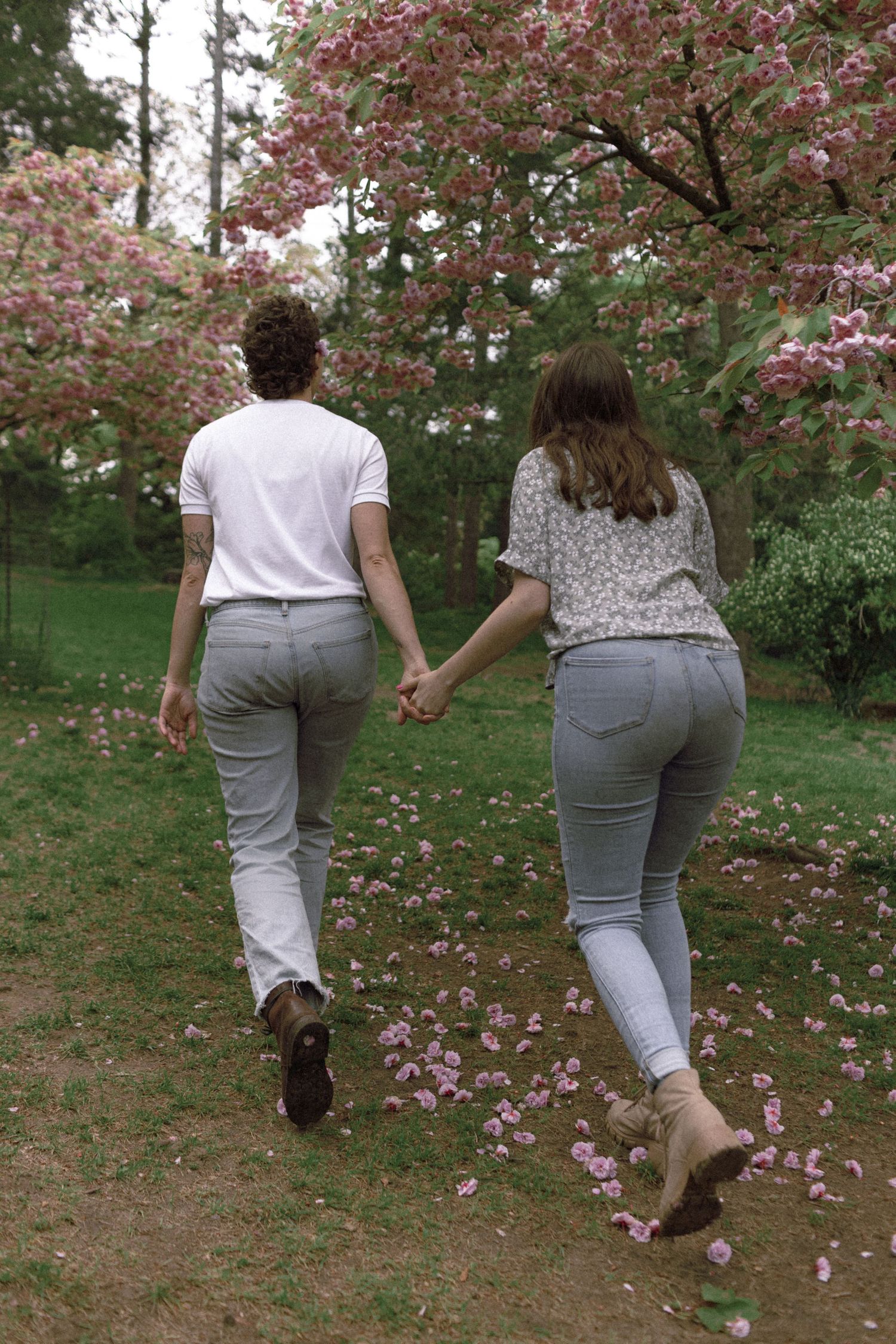 Lesbian American Couple’s Engagement Photoshoot at High Park in Toronto during Cherry Blossom
