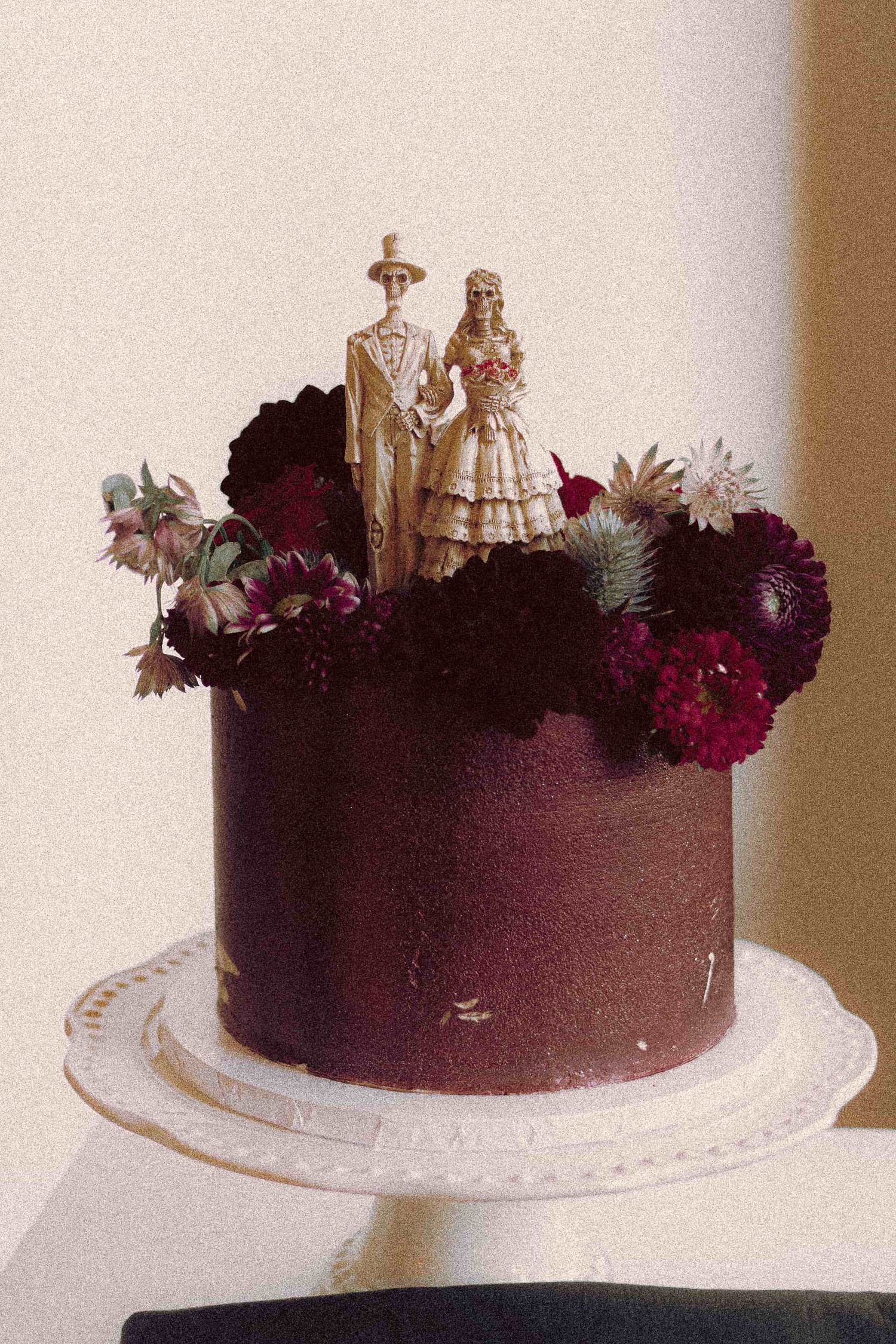 Gothic wedding cake featuring dramatic dark details and romantic styling.