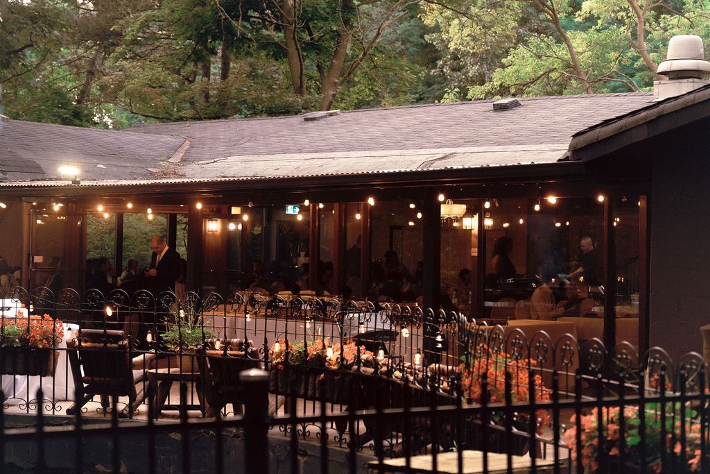 Wedding reception interior at Fantasy Farm Toronto showing warm summer evening atmosphere