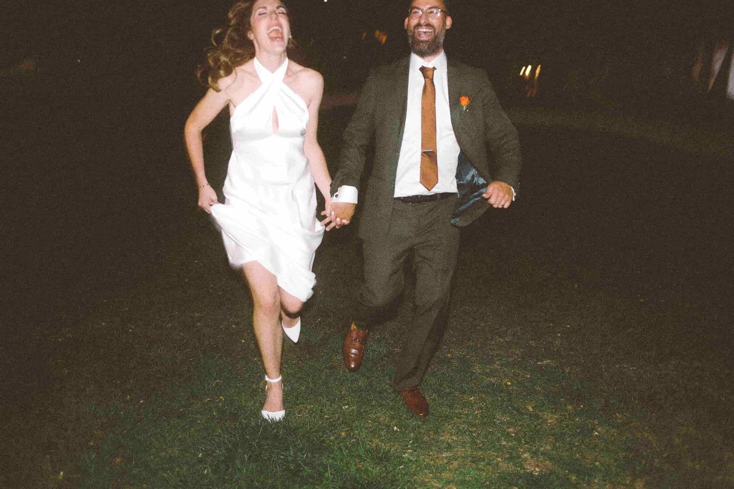 Newly married couple walking together near MOCA Toronto after their ceremony.
