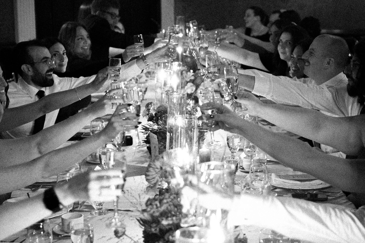 guests cheering during wedding dinner at Old Mill Toronto fall wedding