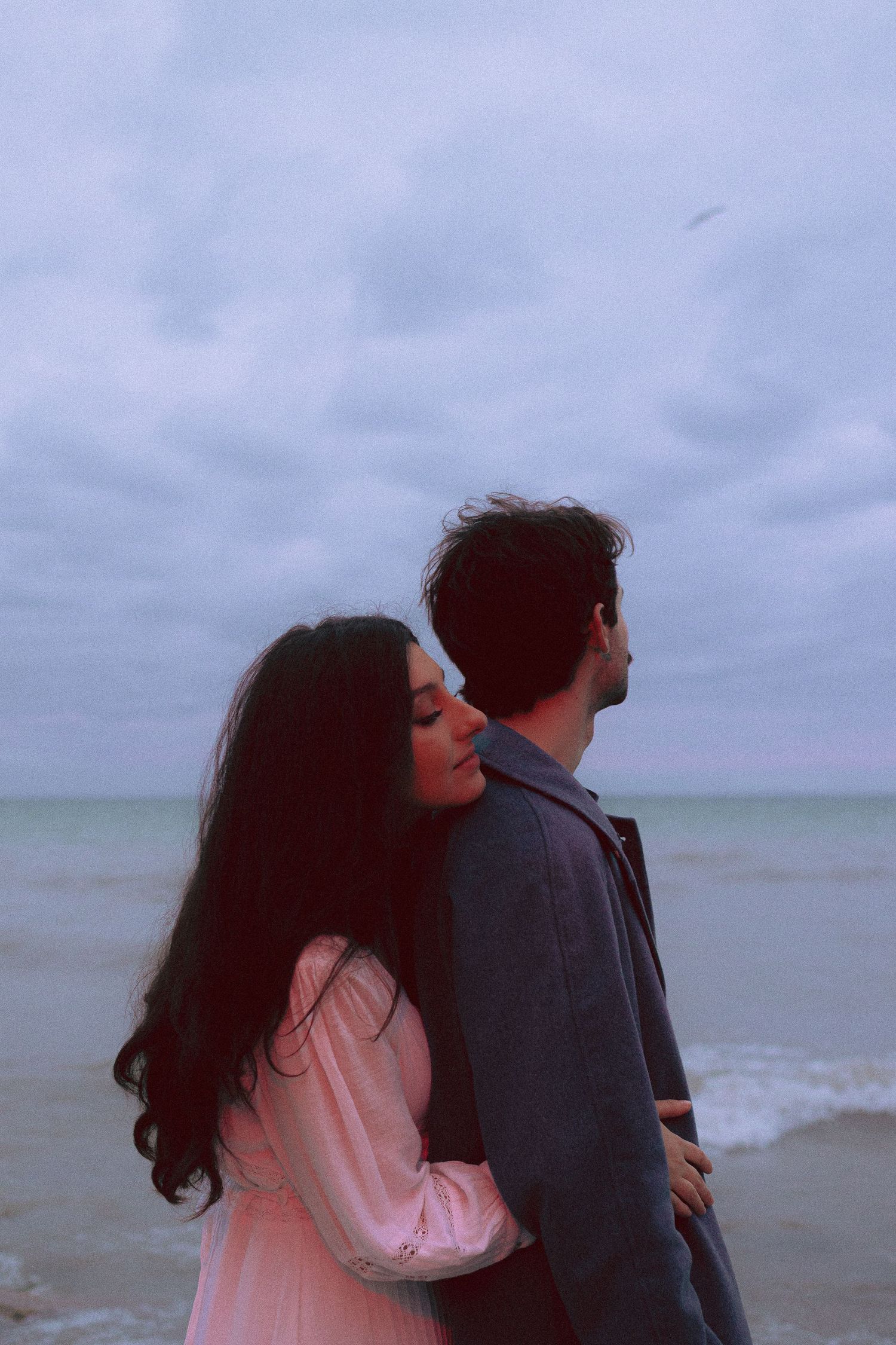 Olivia and Zane engagement session from their home to Queen West and Scarborough Bluffs, moody, unposed, intimate couple photos in Toronto.