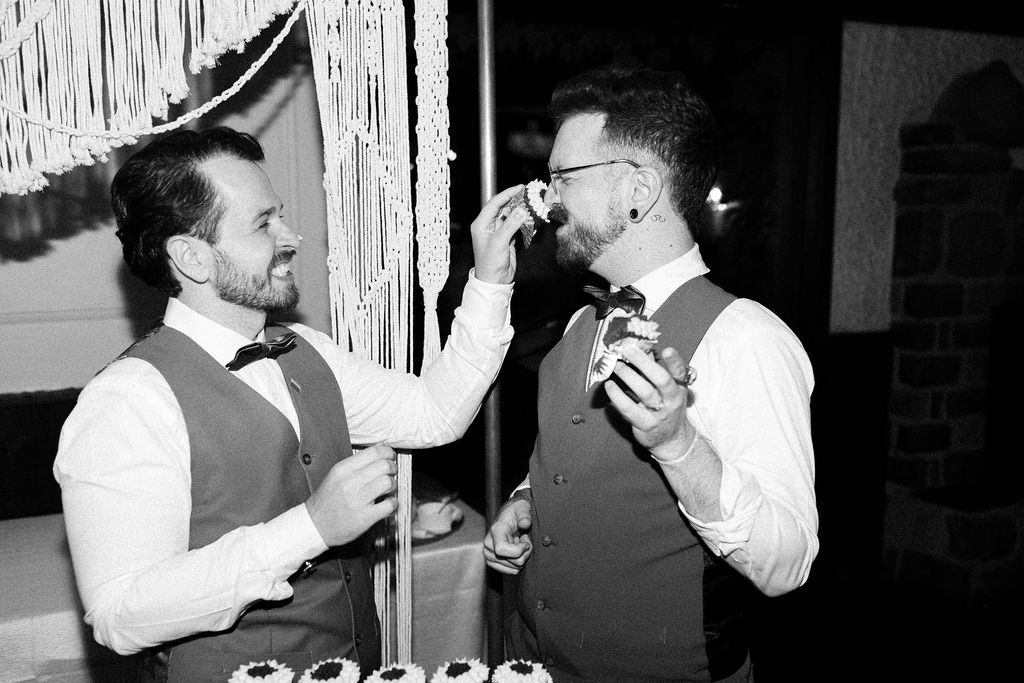 Same-sex couple cutting a cake during their wedding a fantasy farm Toronto