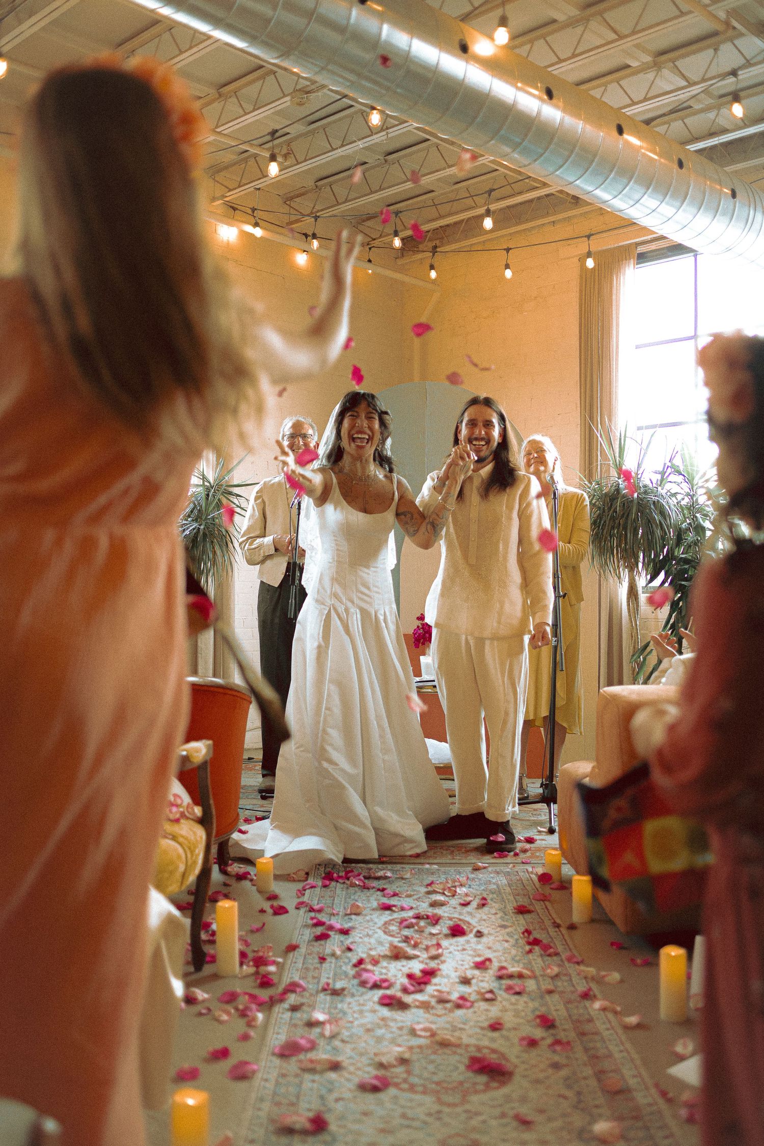 Bride and Groom at their wedding ceremony at eclectic Junto Studio in Toronto
