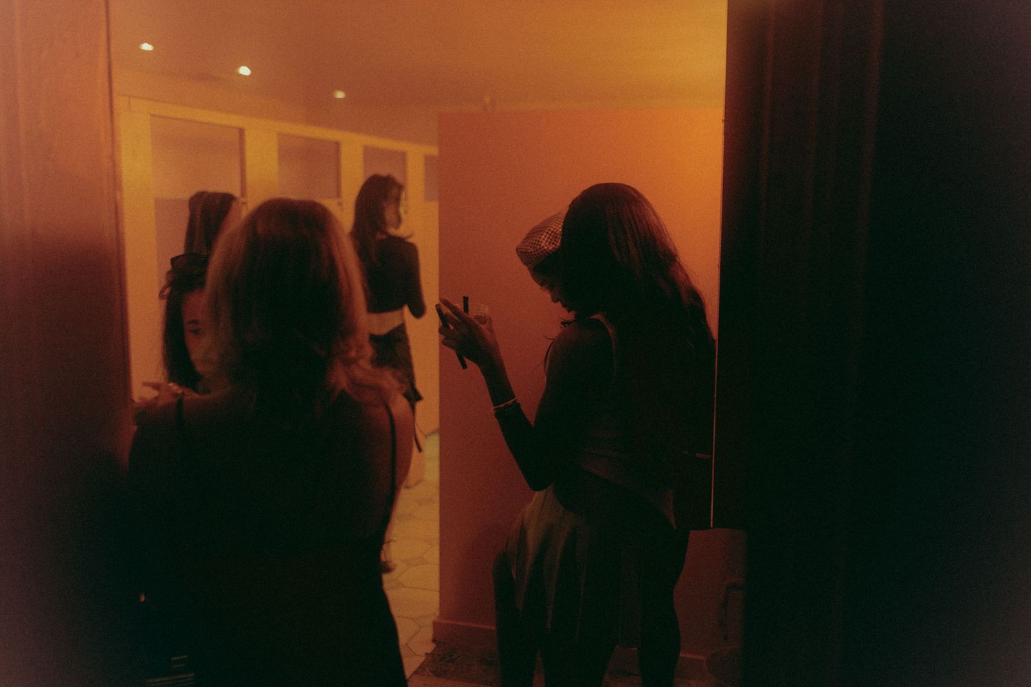 Girls kiking in the washroom, photo taken during the 420 Ball at Hush Hush