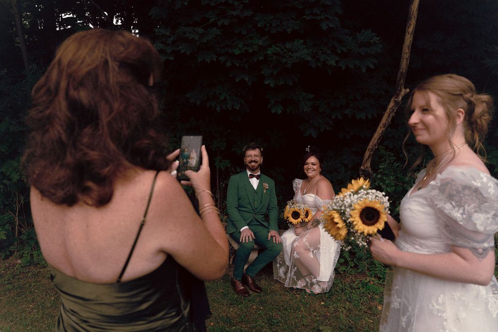 Wedding party carrying sunflowers during gay wedding ceremony at Fantasy Farm Toronto