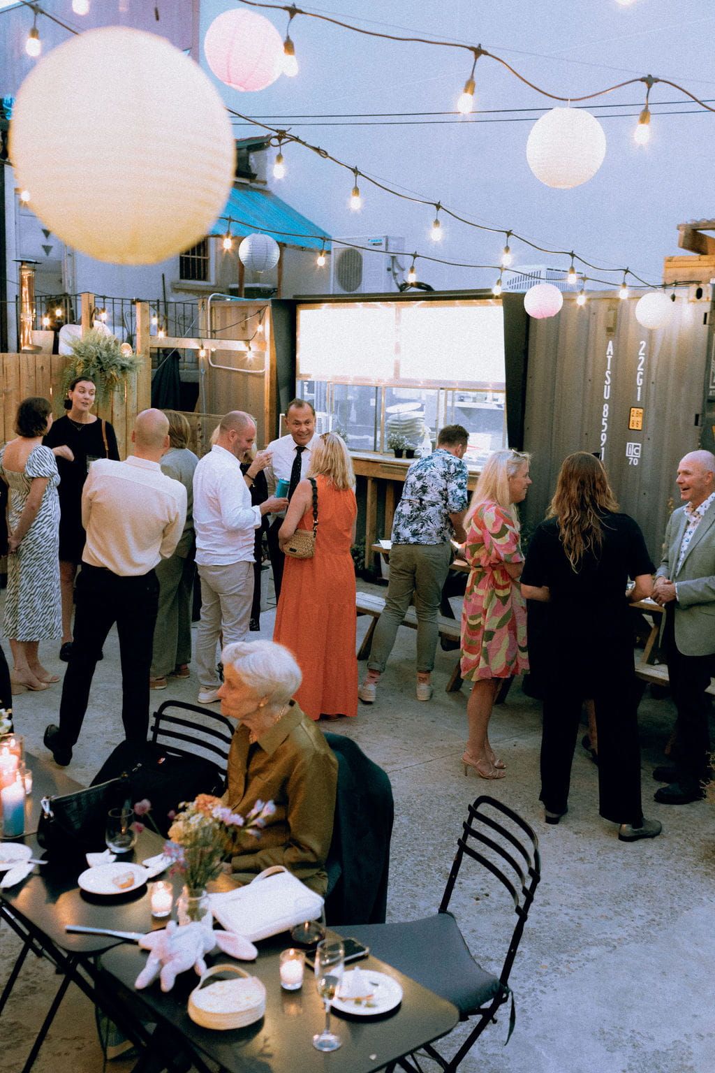 Late summer evening celebration at Bar Neon Toronto patio after queer commitment ceremony