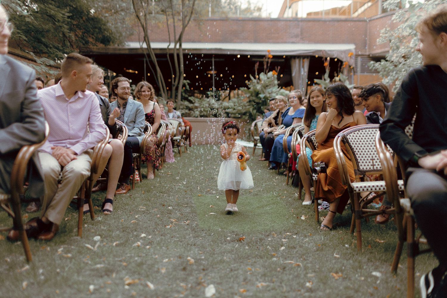 Outdoor ceremony in courtyard at Granite Brewery Toronto surrounded by September greenery