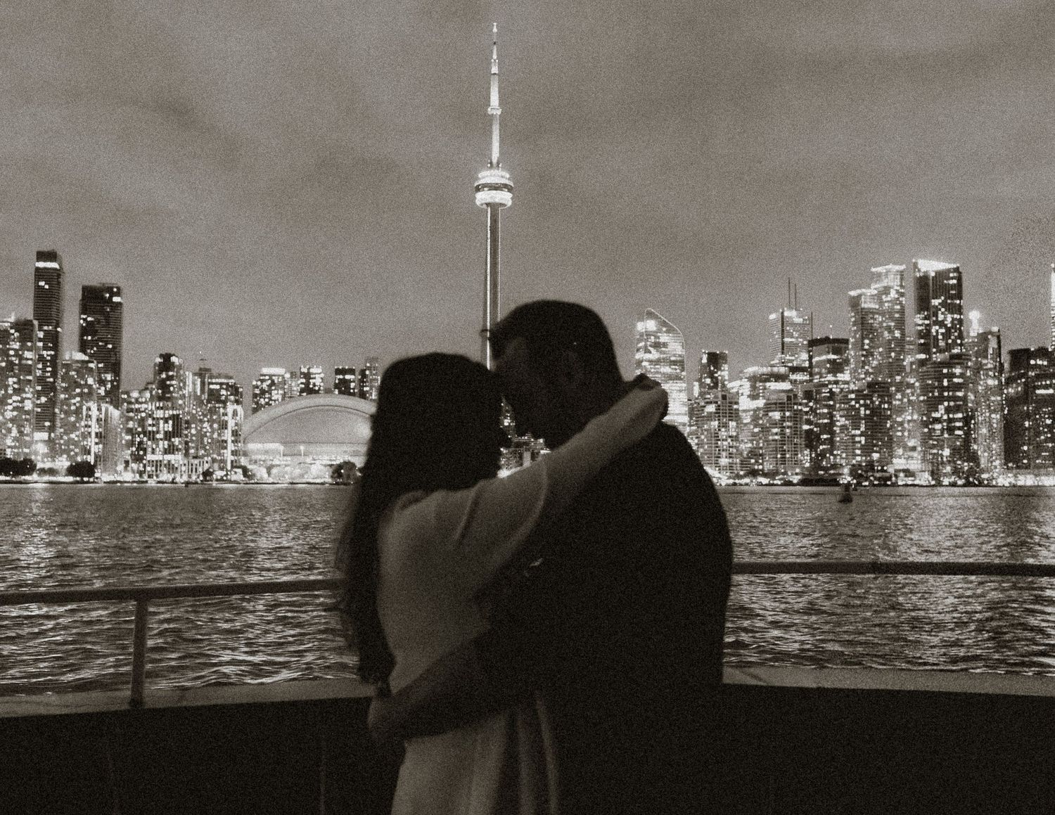 bride and groom in front of Toronto skyline on Toronto Island