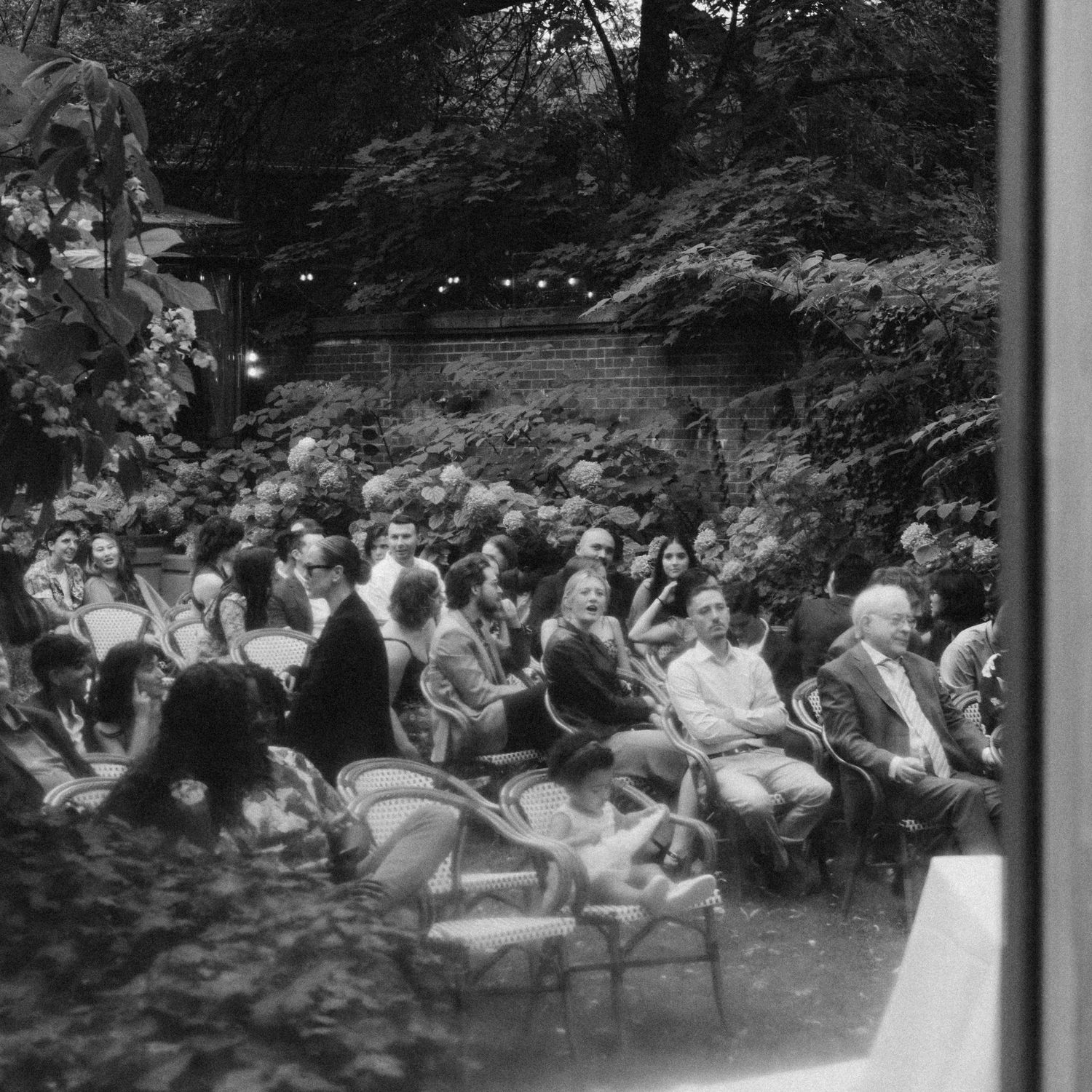 Outdoor ceremony in courtyard at Granite Brewery Toronto surrounded by September greenery