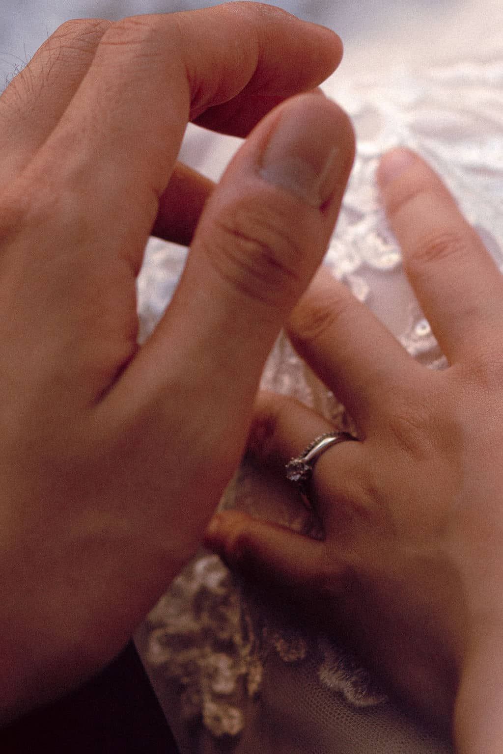 Couple holding hands during private vows at Scarborough Bluffs