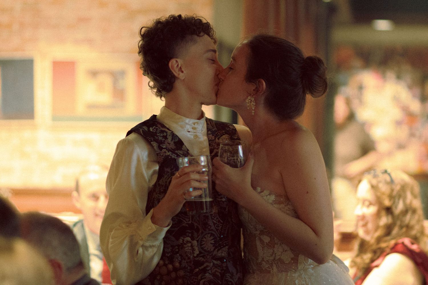 queer Wedding couple mingling with guests at Granite Brewery Toronto reception