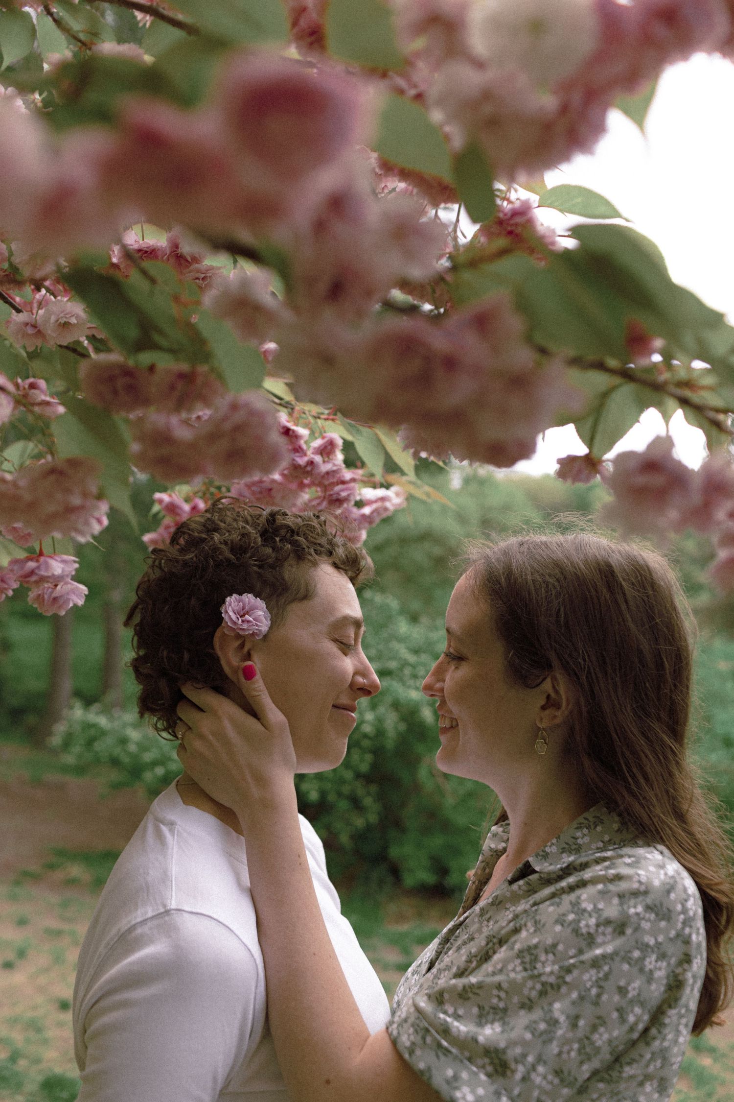 Lesbian American Couple’s Engagement Photoshoot at High Park in Toronto during Cherry Blossom
