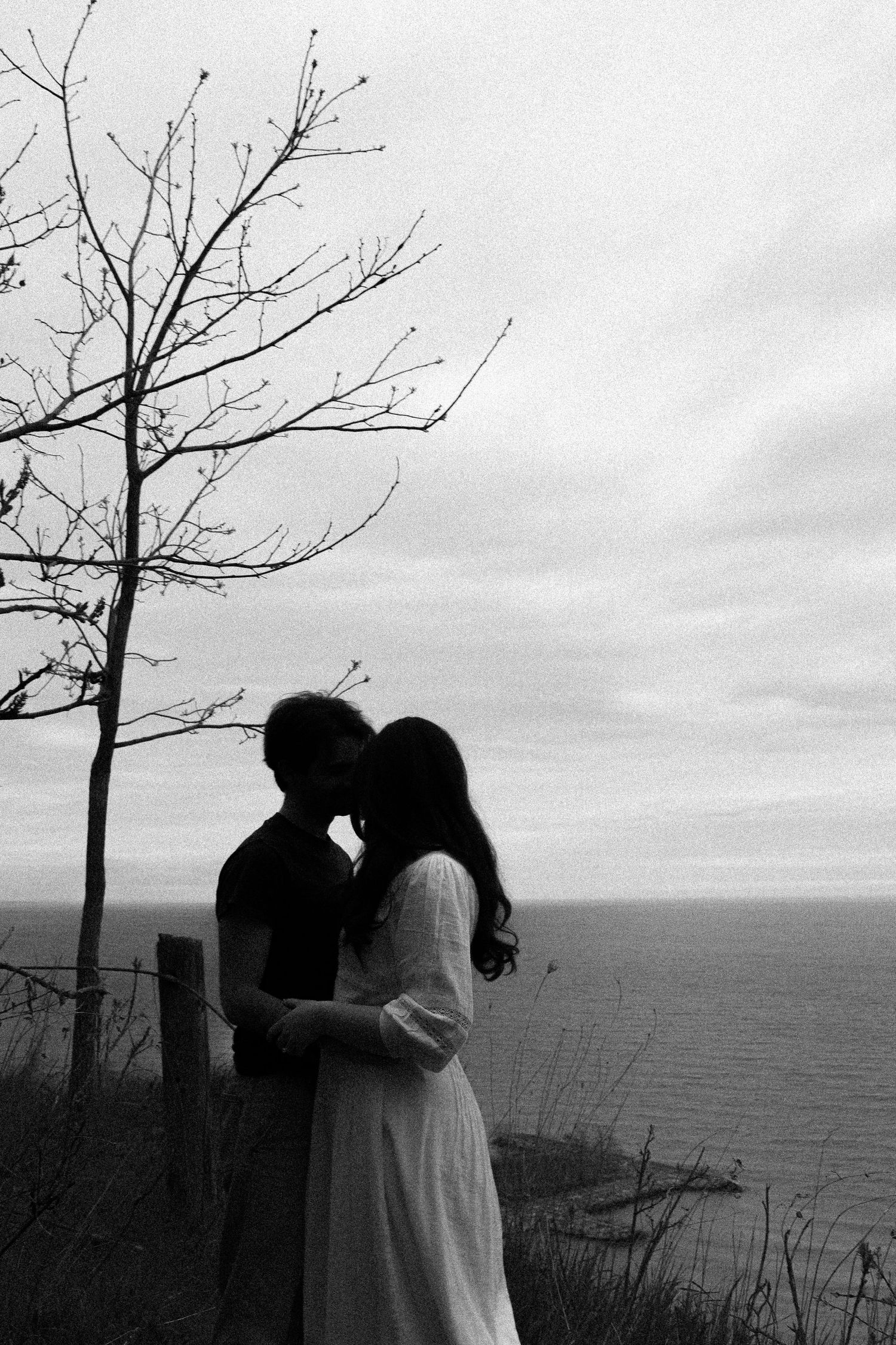 Olivia and Zane engagement session from their home to Queen West and Scarborough Bluffs, moody, unposed, intimate couple photos in Toronto.