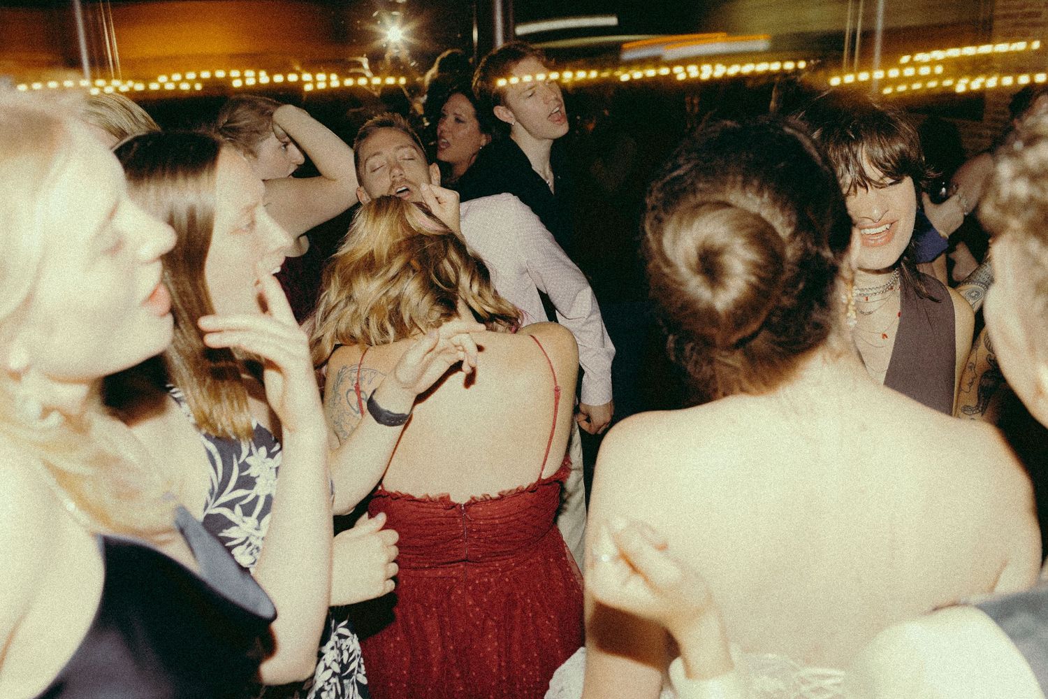Guests dancing at queer wedding reception Granite Brewery Toronto