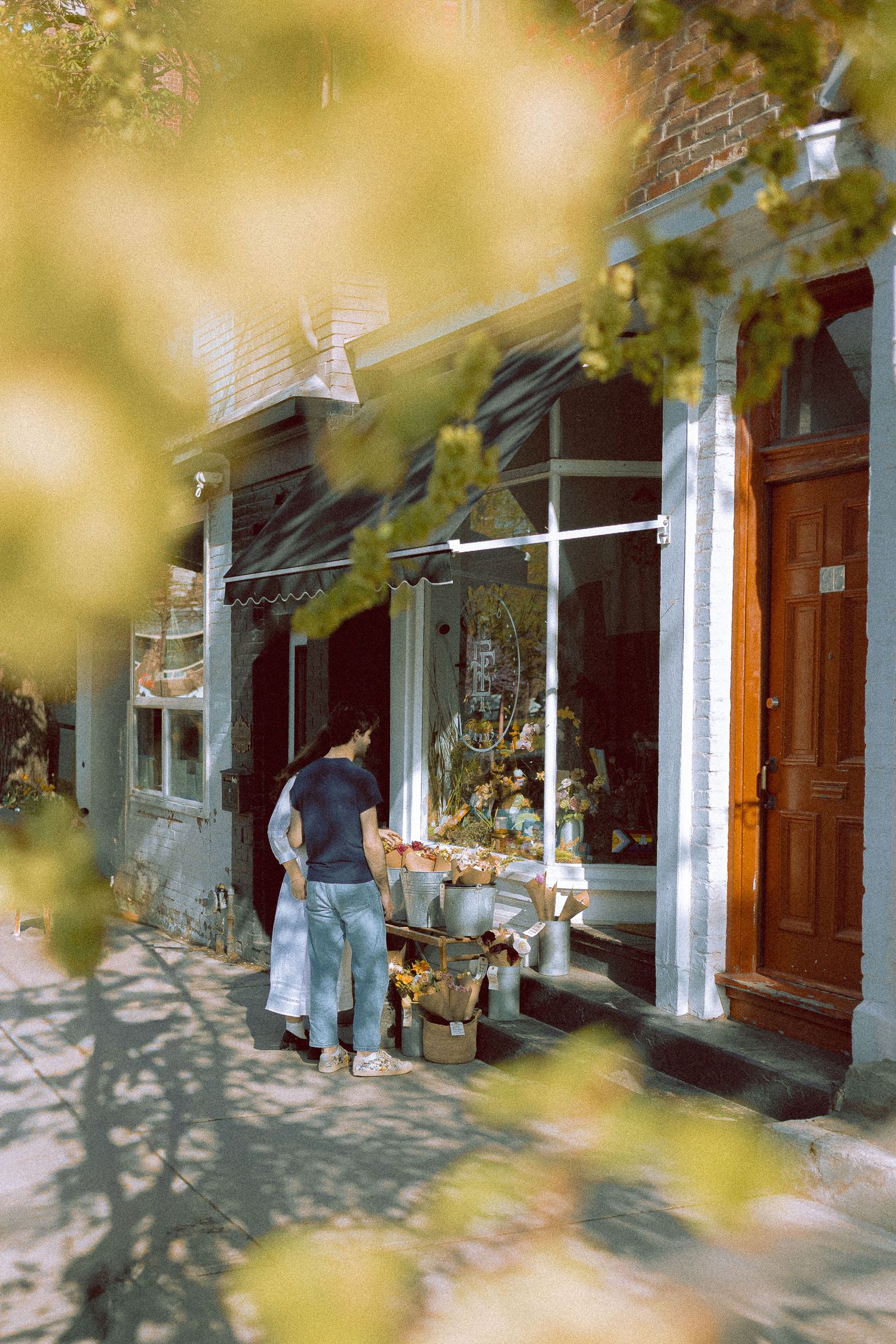 Olivia and Zane engagement session from their home to Queen West and Scarborough Bluffs, moody, unposed, intimate couple photos in Toronto.