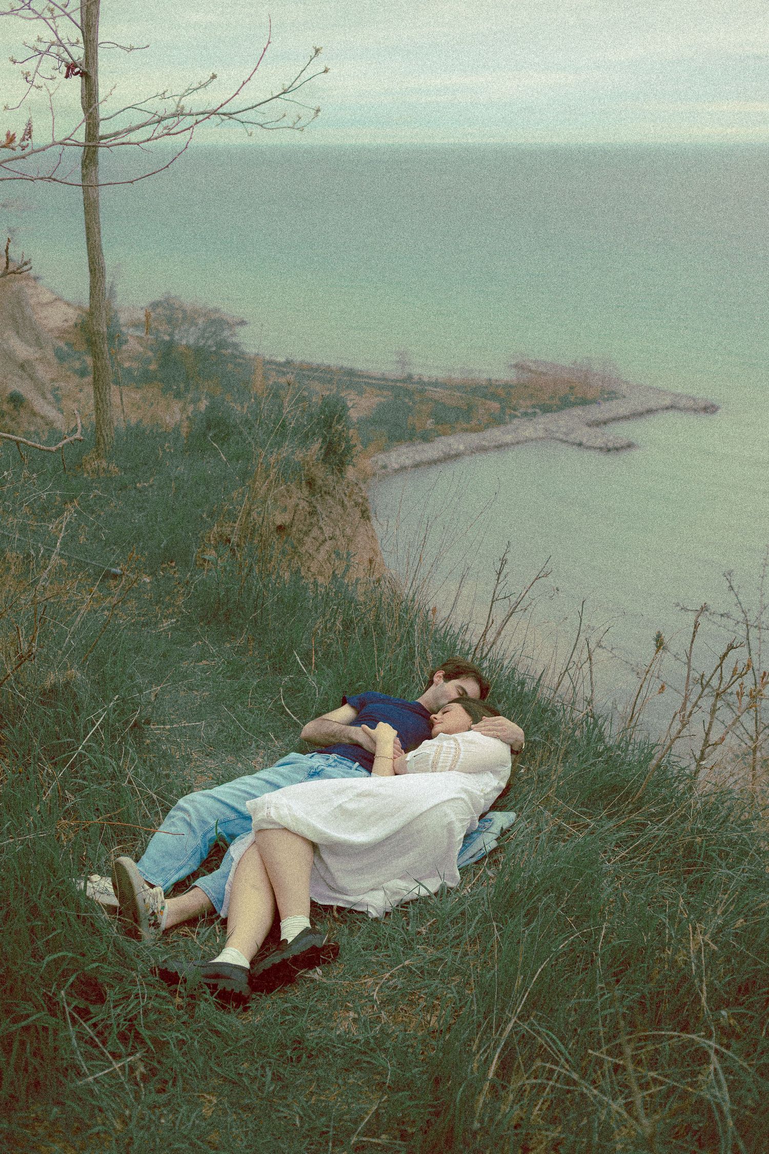 Olivia and Zane engagement session from their home to Queen West and Scarborough Bluffs, moody, unposed, intimate couple photos in Toronto.