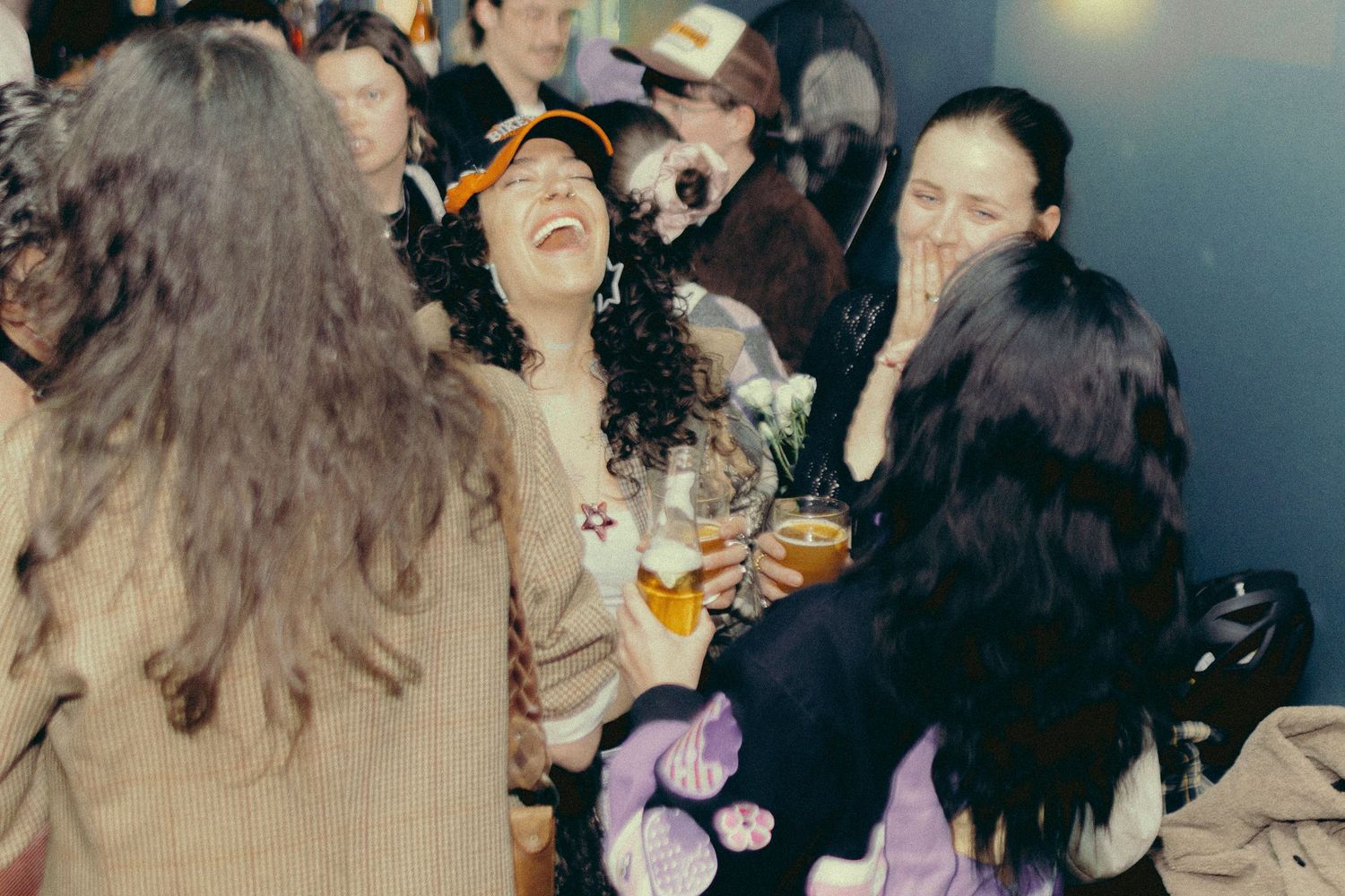 Guests laughing at the Three Dollar Bill during a lesbian event organized by QT Mag.