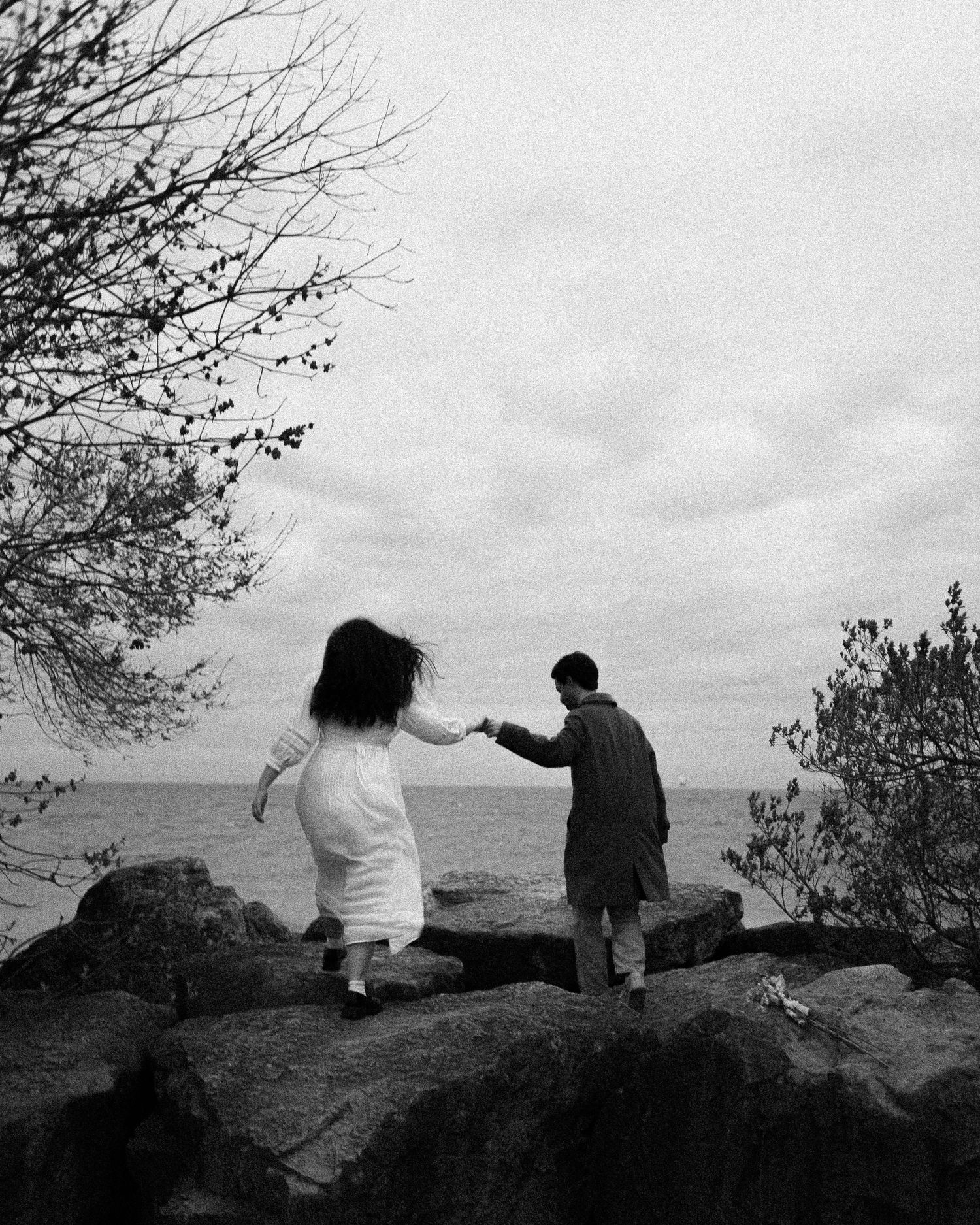 Olivia and Zane engagement session from their home to Queen West and Scarborough Bluffs, moody, unposed, intimate couple photos in Toronto.