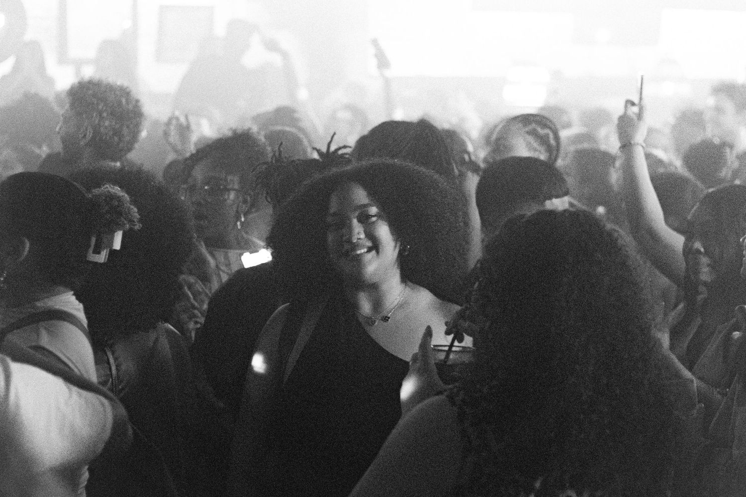 Photo of  a black woman in the middle of the dance floor during YES YES Y'ALL birthday party
