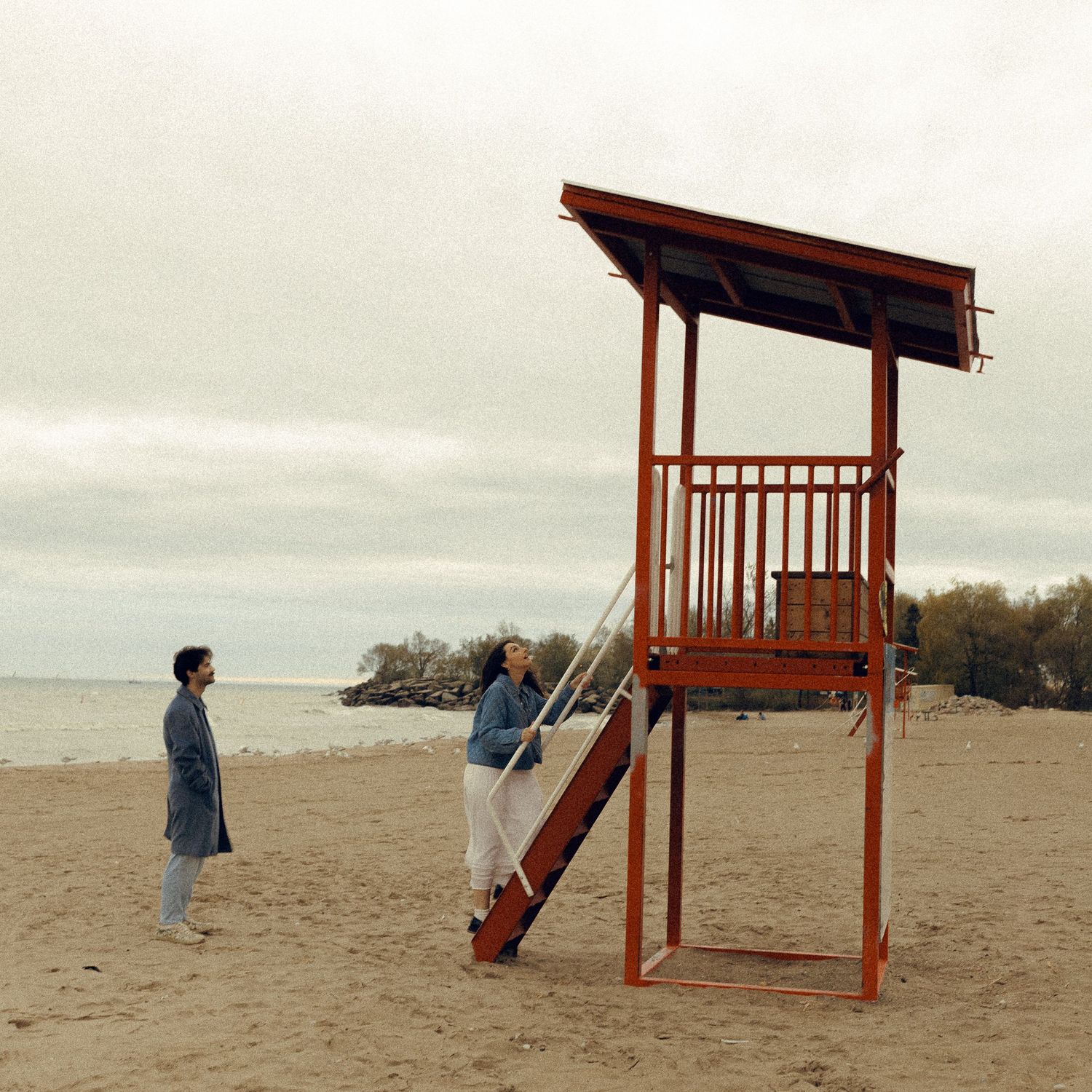 Olivia and Zane engagement session from their home to Queen West and Scarborough Bluffs, moody, unposed, intimate couple photos in Toronto.