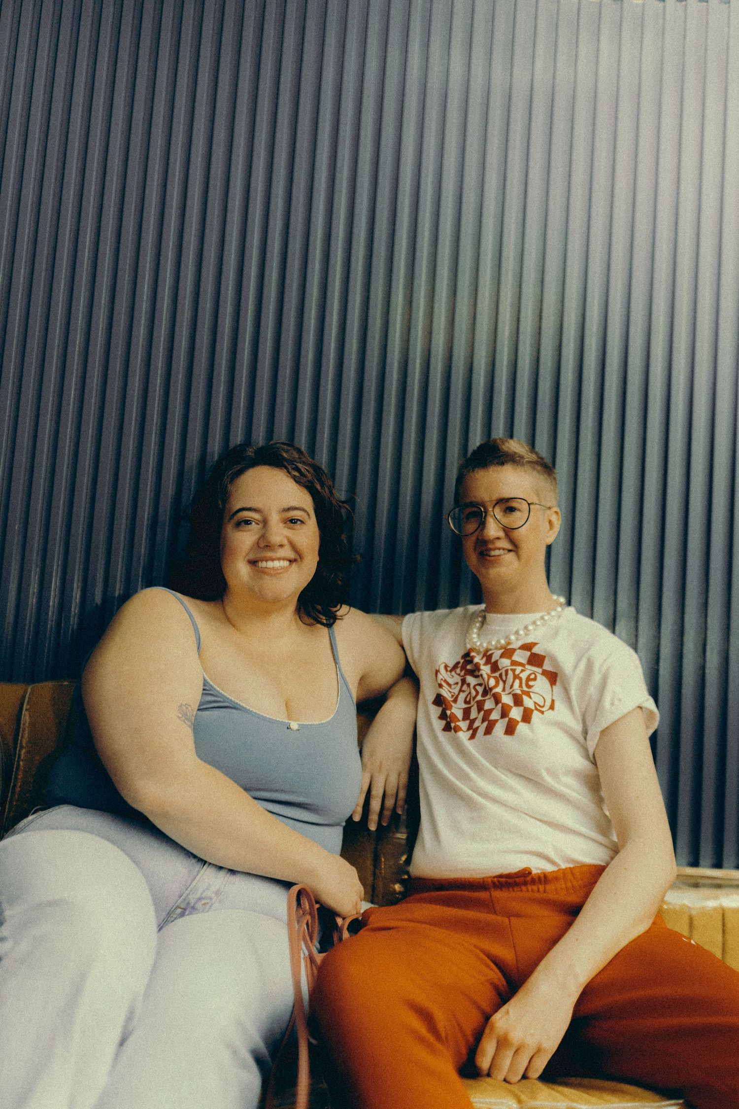 Lesbian couple posing at the Three Dollar Bill during a lesbian event organized by QT Mag.