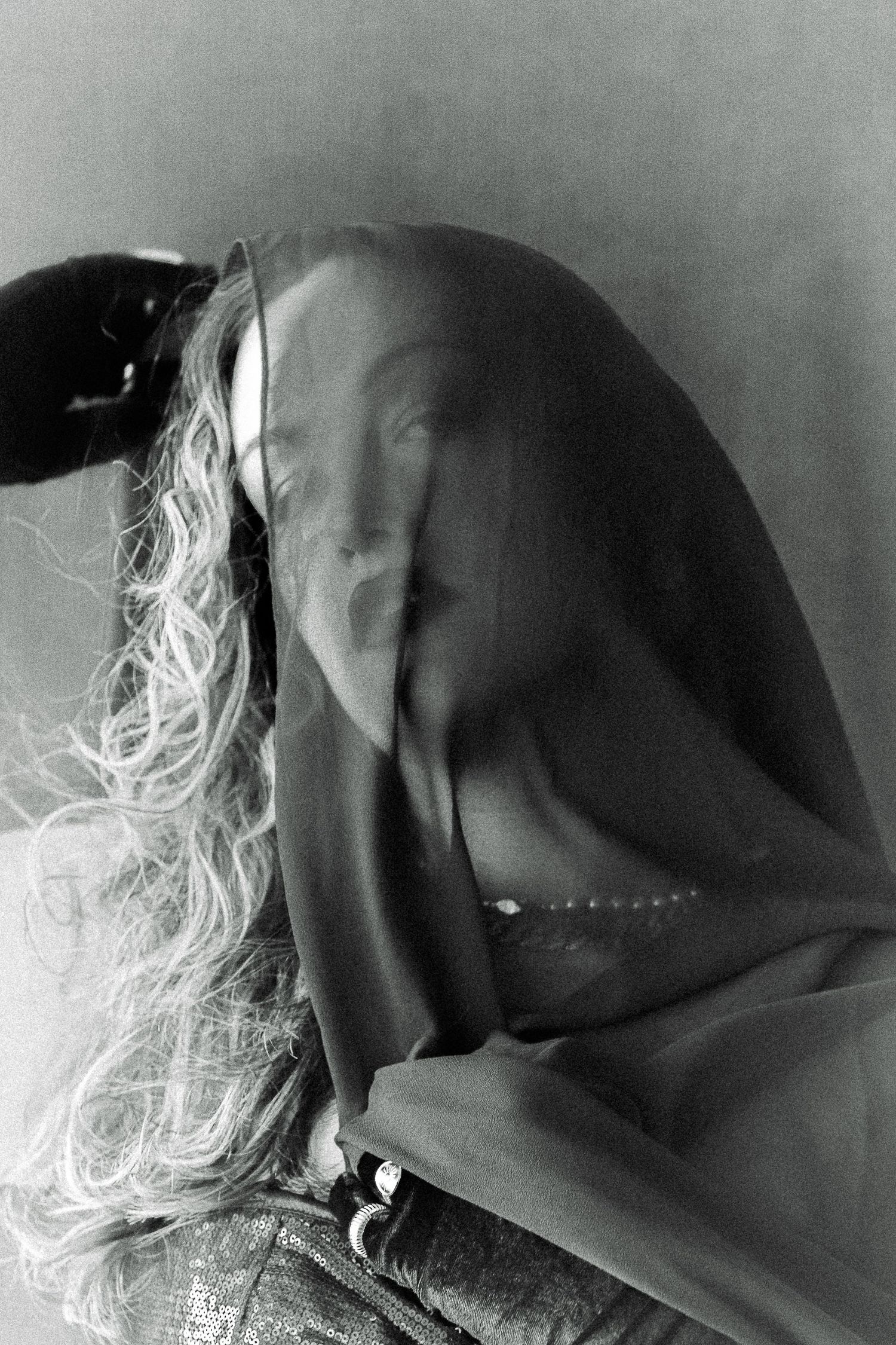 Portrait of Jules, a transwoman exuding confidence, beauty and strength. inspired by Man Ray black and white portraits.