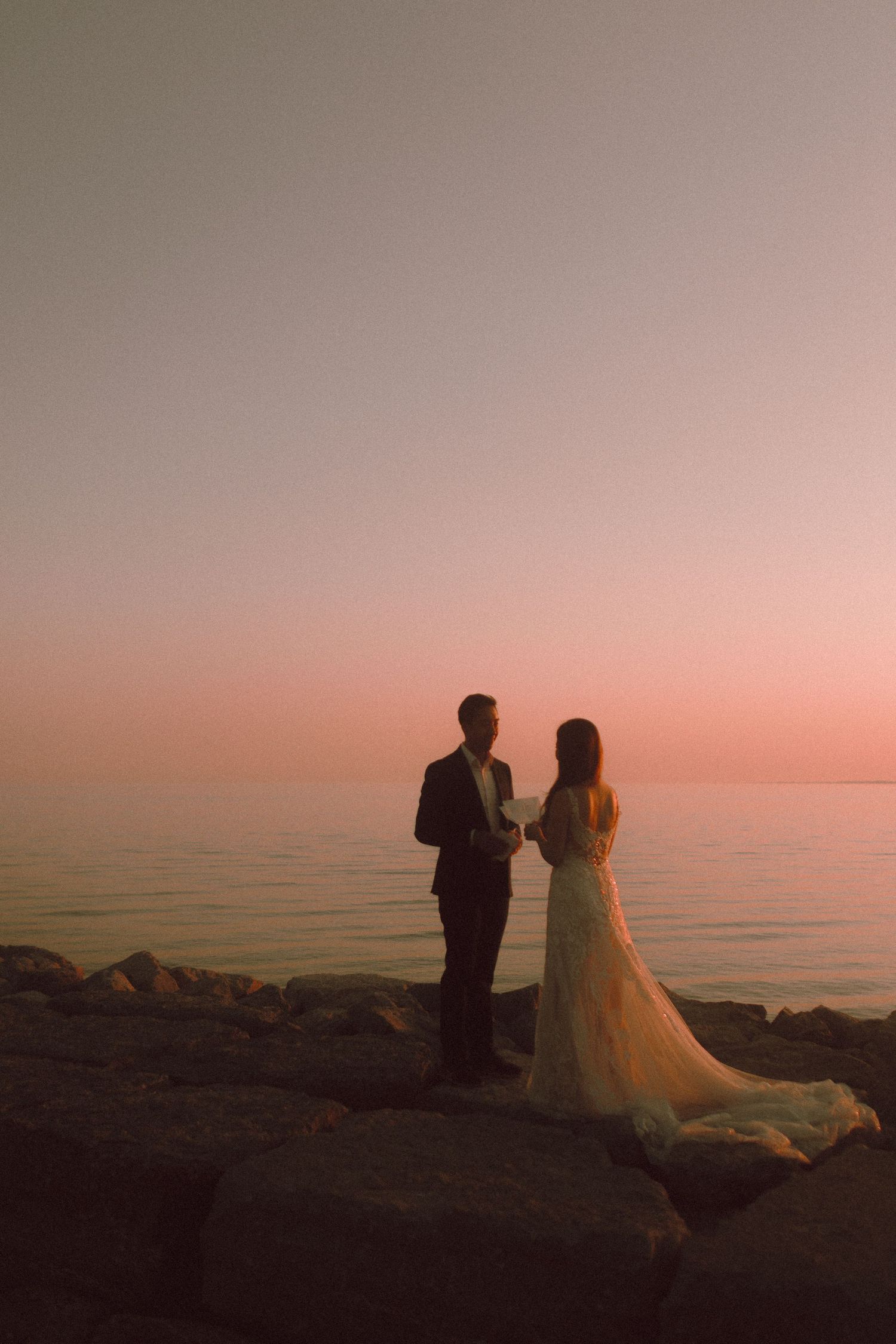 Asian couple wedding shoot at Kensington Market and Scarborough Bluffs with emotional sunset vow reading, candid, romantic, Toronto-based