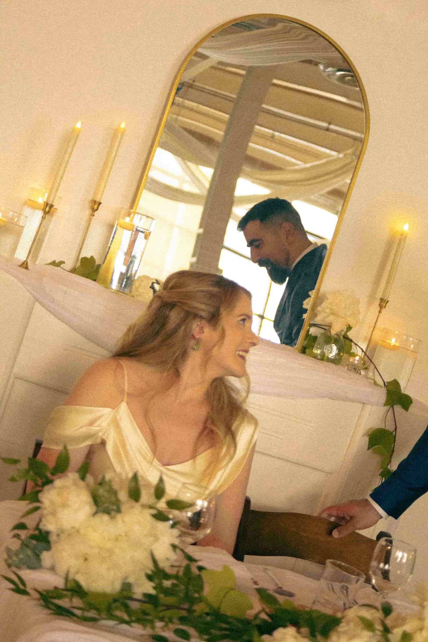 Newlyweds enjoying a quiet moment together during their reception.