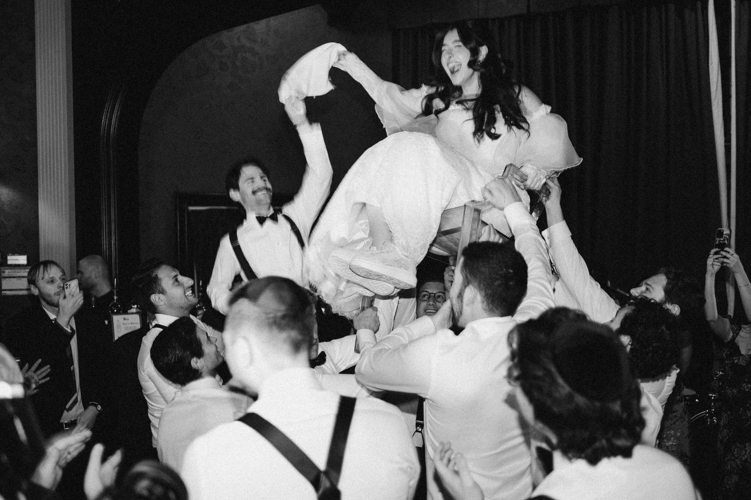 Bride and Groom during Jewish tradition hora at Old Mill Toronto Fall wedding