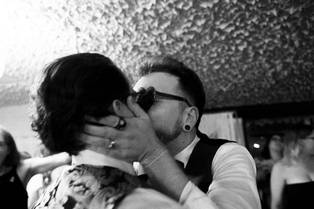 Same-sex couple kissing during their wedding a fantasy farm Toronto