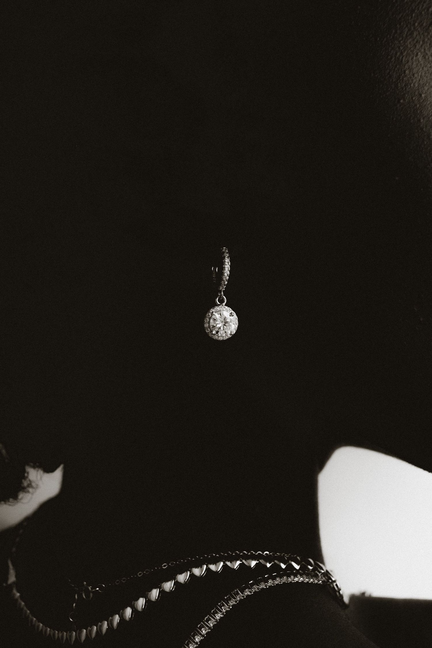 Back and white Portrait of a black model posing for Goldmacher jewelry brand.
