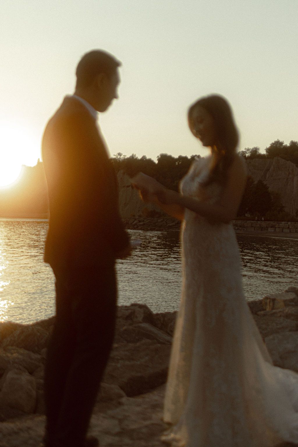 Couple exchanging private vows at Scarborough Bluffs during sunset
