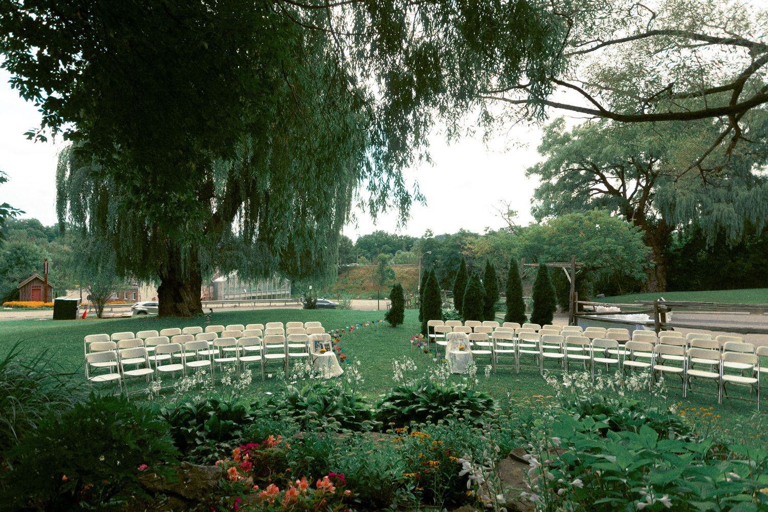 Outdoor ceremony at Fantasy Farm in summer, surrounded by vibrant greenery and natural light