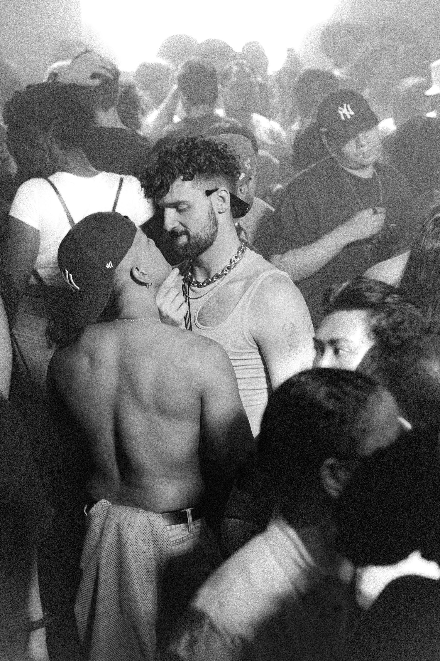 Photo of two gay man starring at each other in the middle of the dance floor during YES YES Y'ALL birthday party