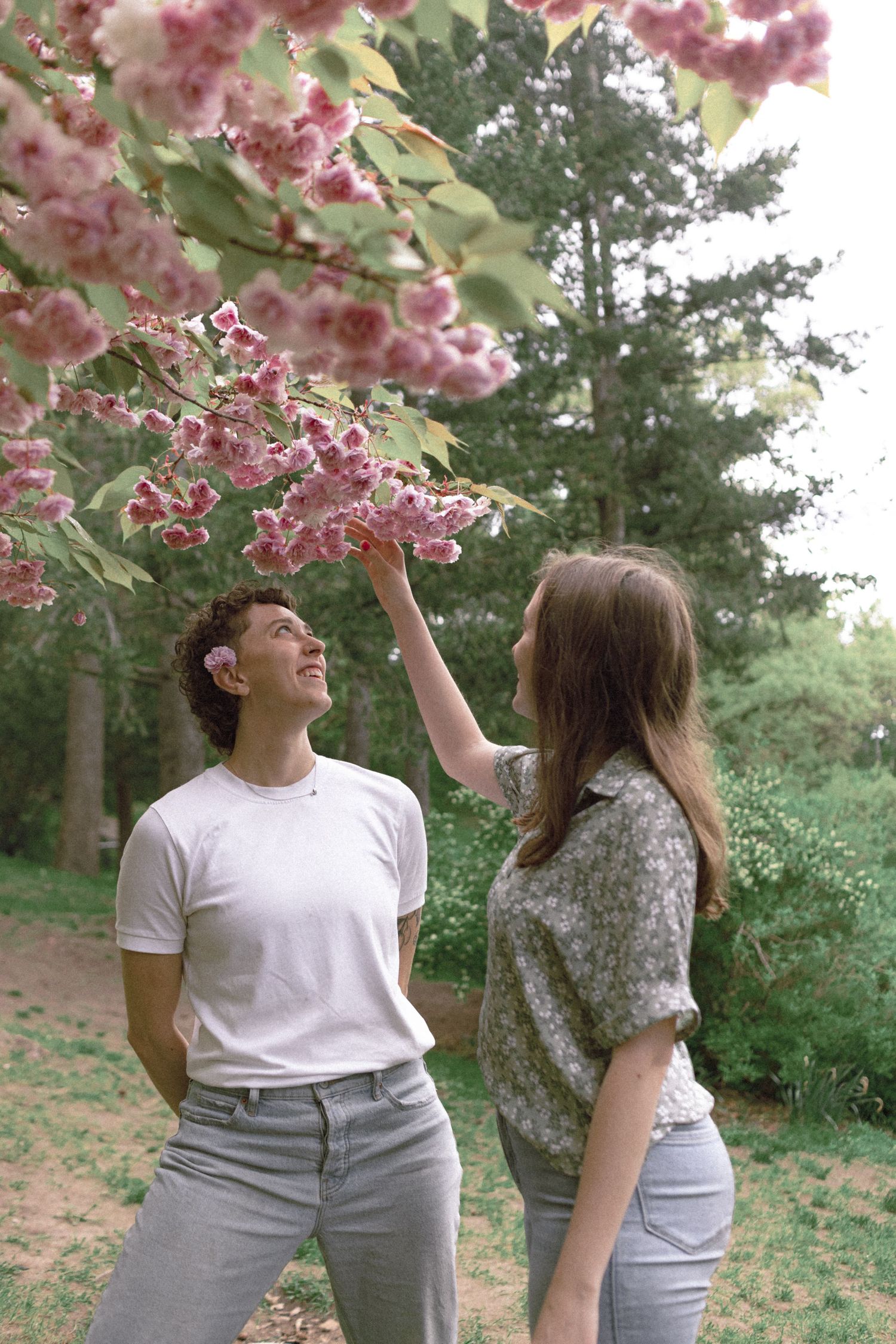 Lesbian American Couple’s Engagement Photoshoot at High Park in Toronto during Cherry Blossom