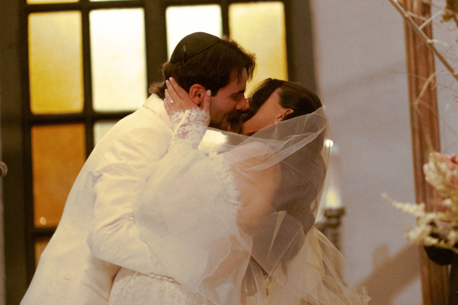 Bride and Groom first kiss at Old Mill Toronto wedding