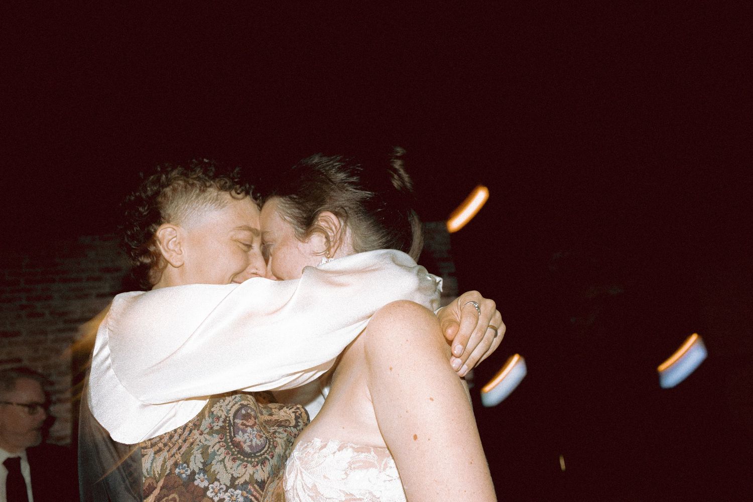 Brides dancing at queer wedding reception Granite Brewery