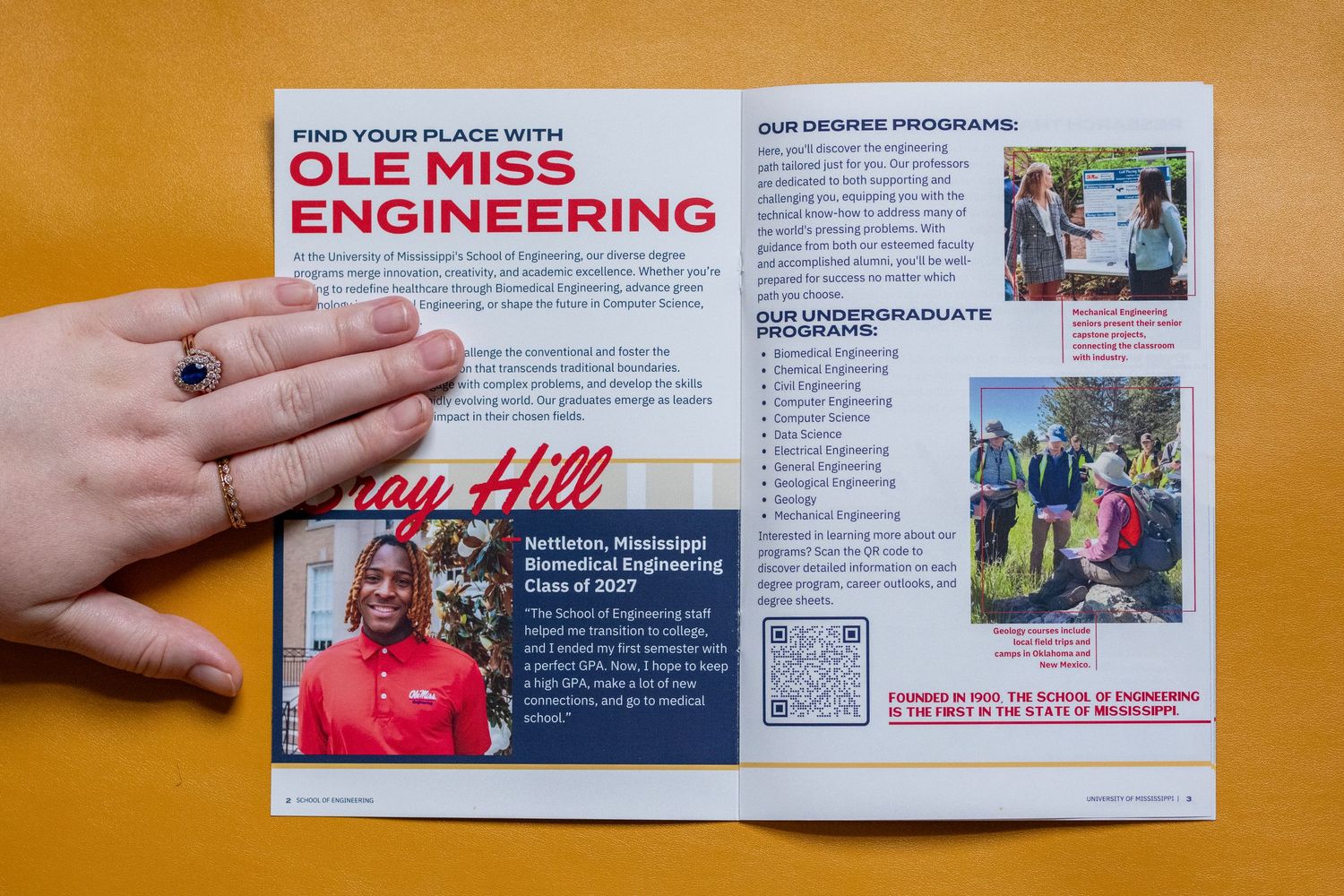 Ole Miss Engineering program brochure open on yellow surface, featuring undergraduate and graduate degree programs.