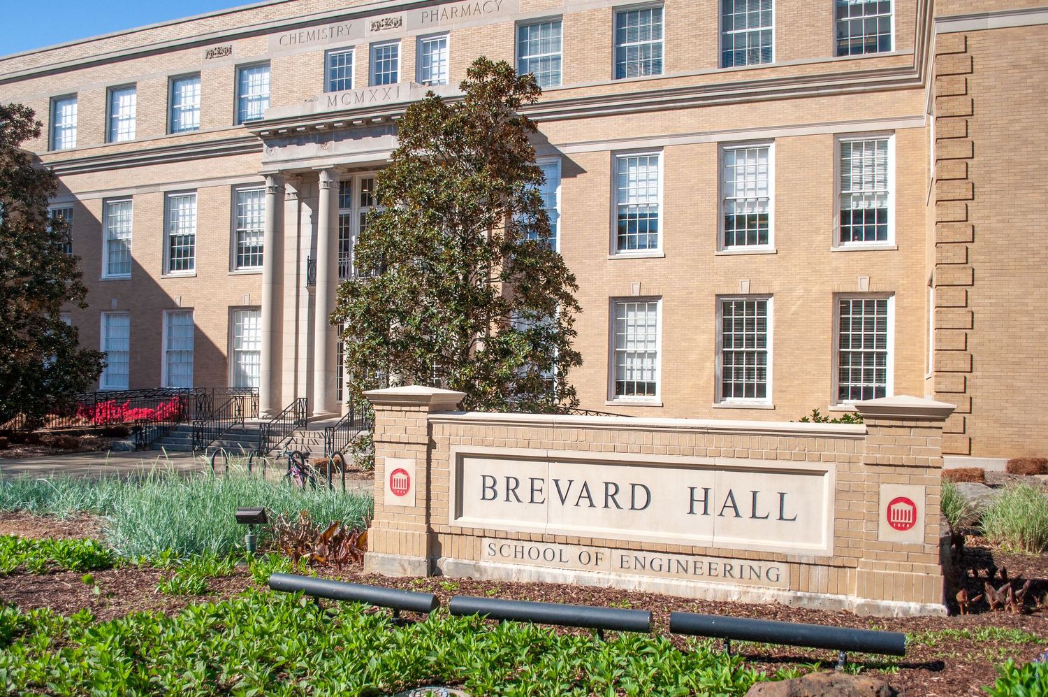 Brevard Hall School of Engineering building at a university campus with manicured landscaping on a sunny day.