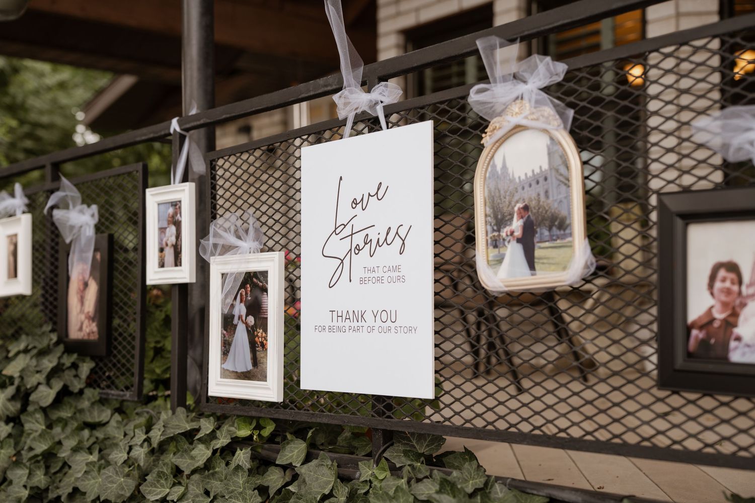Des Moines wedding photographer documenting a family love story history wall at a reception