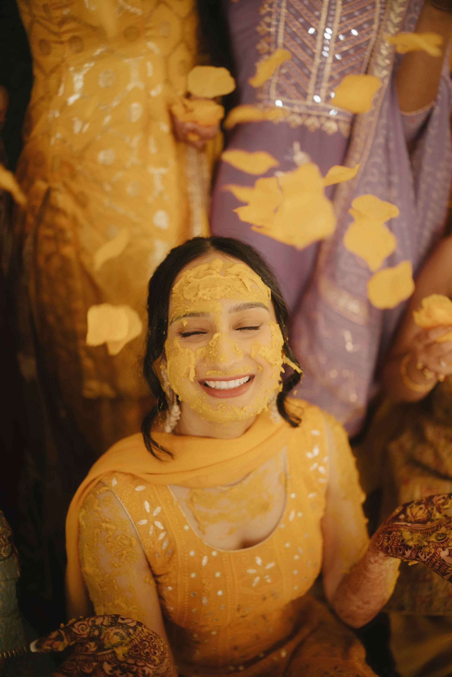 Traditional Indian pre-wedding haldi ceremony with turmeric paste applied during cultural celebrations.
Vatna