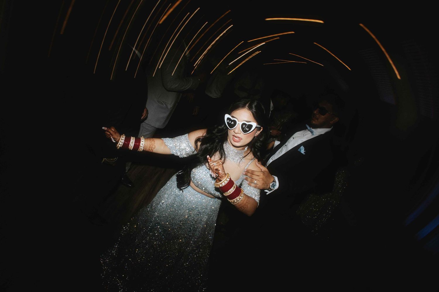 Dynamic nighttime dance floor scene with dramatic lighting and motion blur effects.
Reception photography