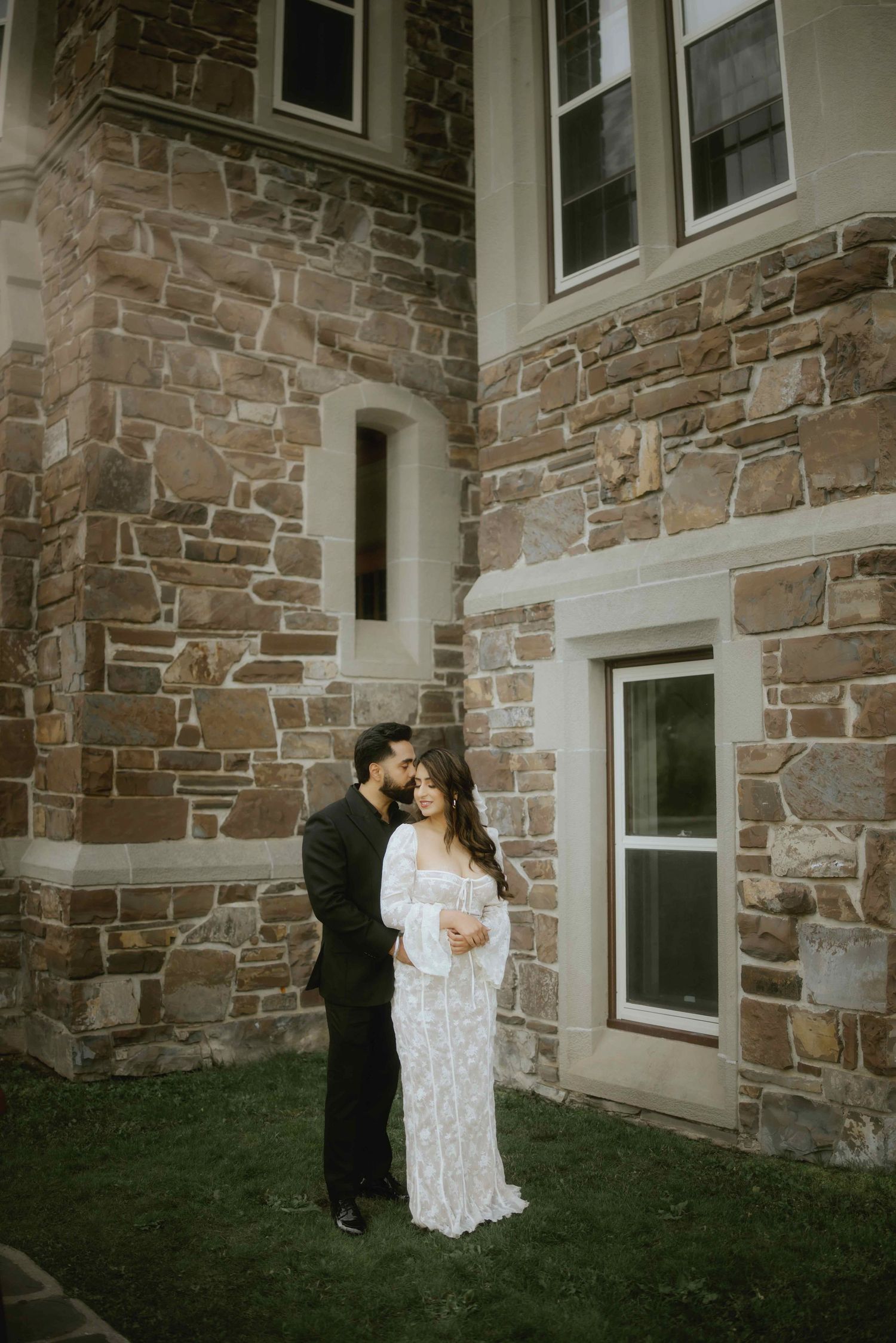 Romantic moment captured against a rustic stone wall exterior of a building.
Fairmont Photography
